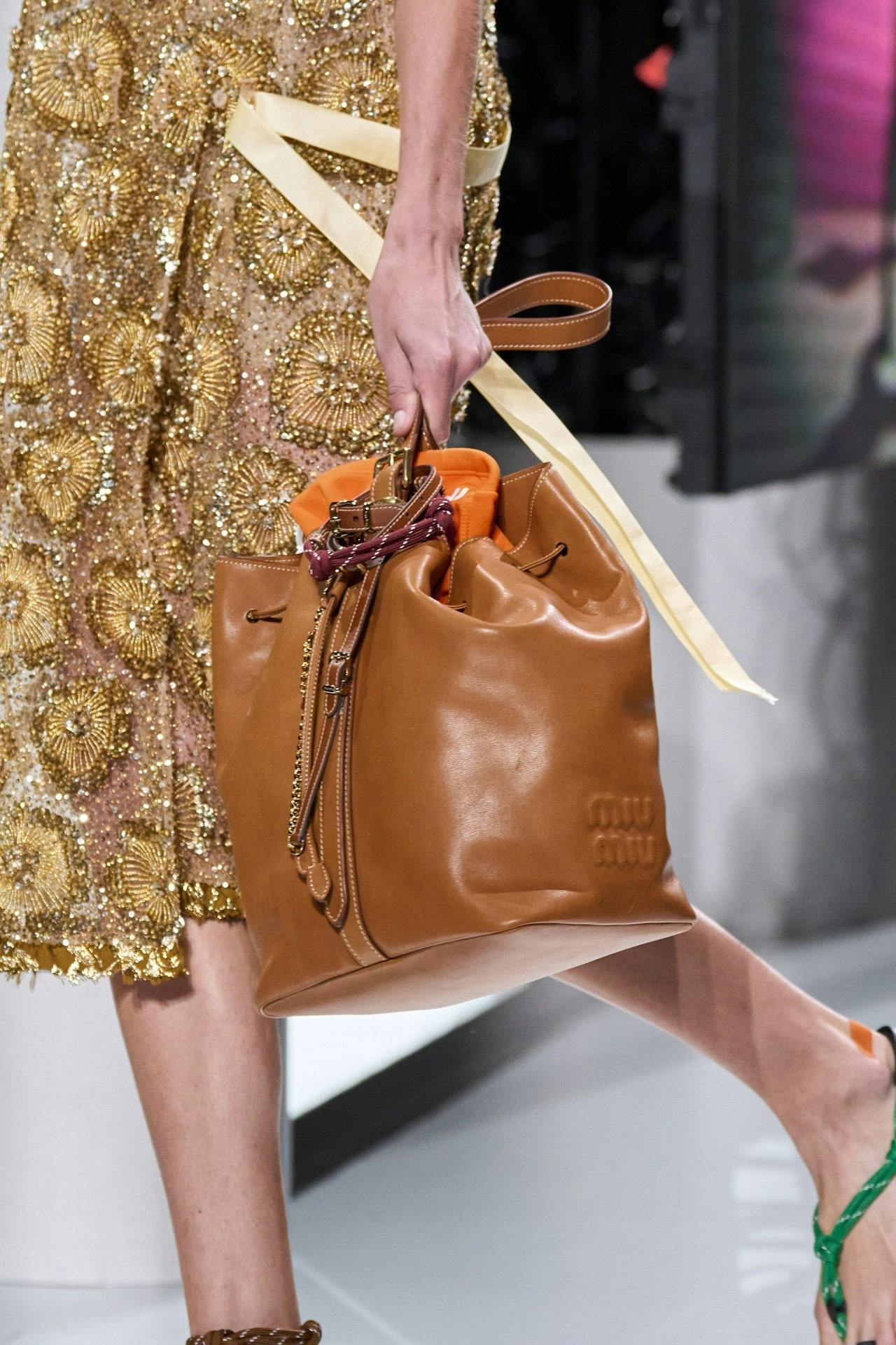 Miu Miu's Spring 2024 Models Carried Bags Stuffed With Stuff