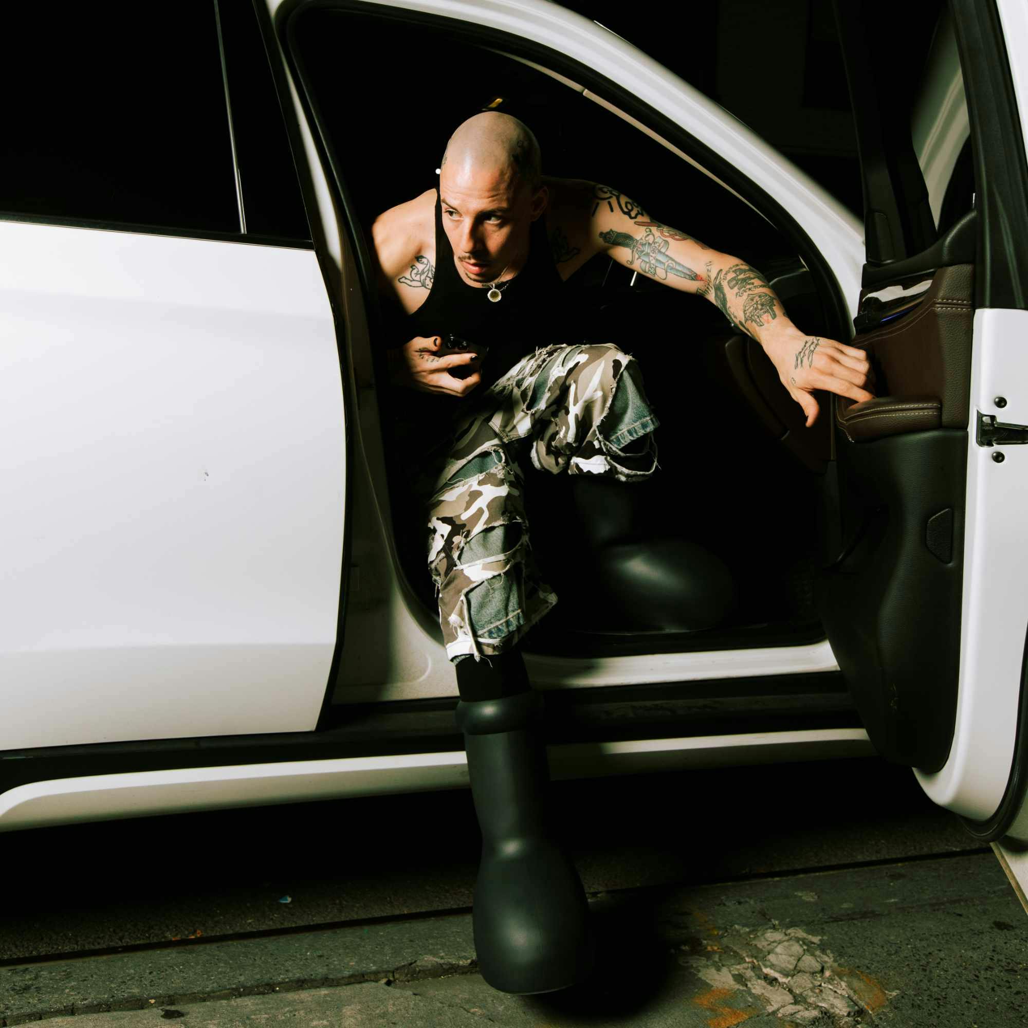 MSCHF's Big Black Boot, as worn by Mitch Modes