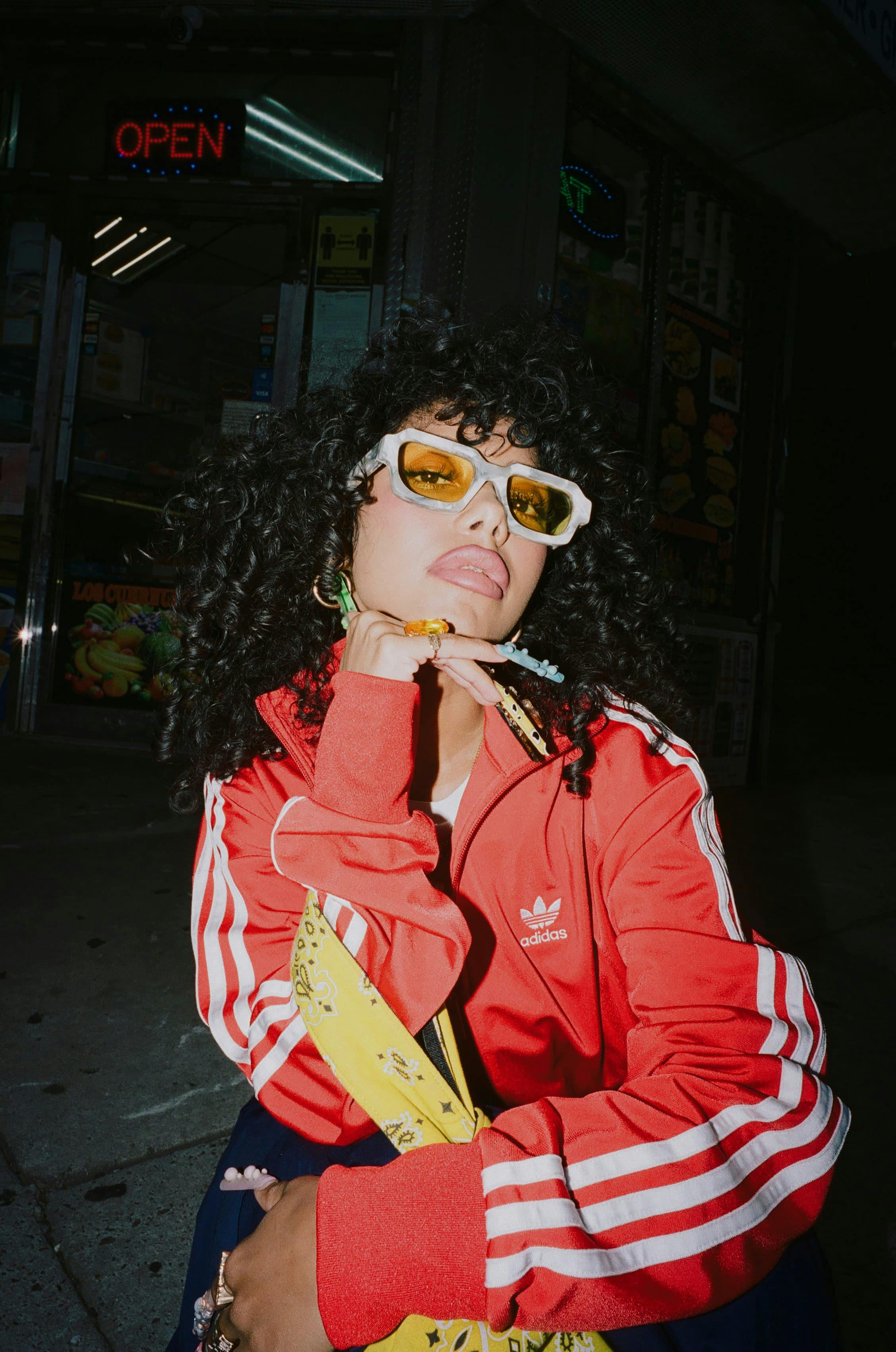 Woman wearing red adidas jacket