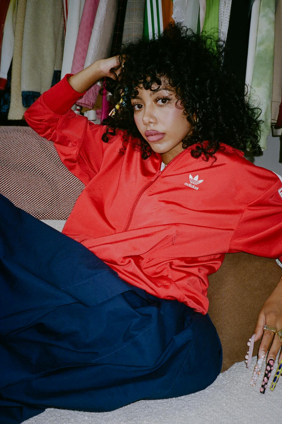 Woman wearing red adidas jacket