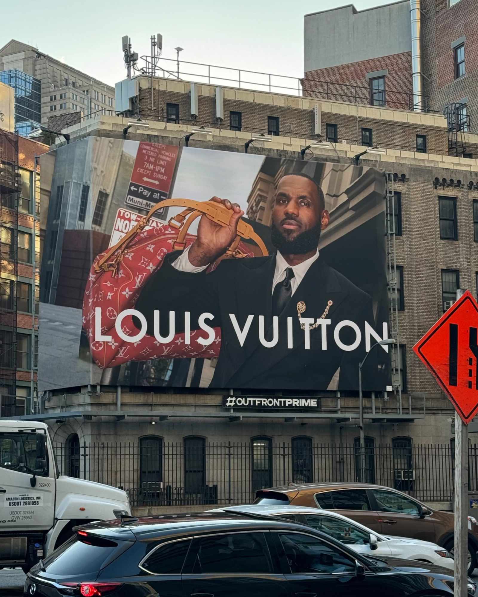 A photo of a Louis Vuitton billboard with LeBron James modeling Pharrell's new collection