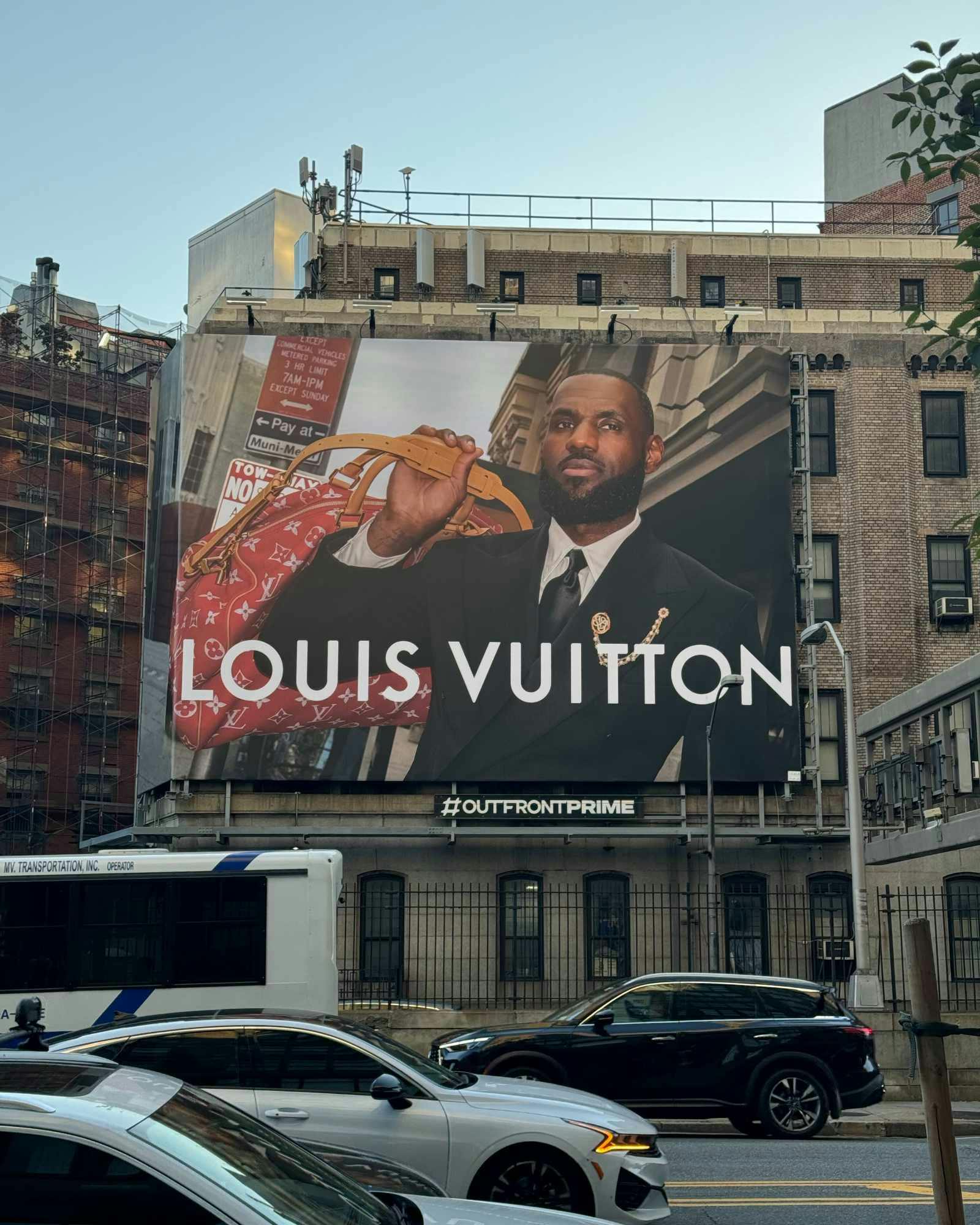 A photo of a Louis Vuitton billboard with LeBron James modeling Pharrell's new collection