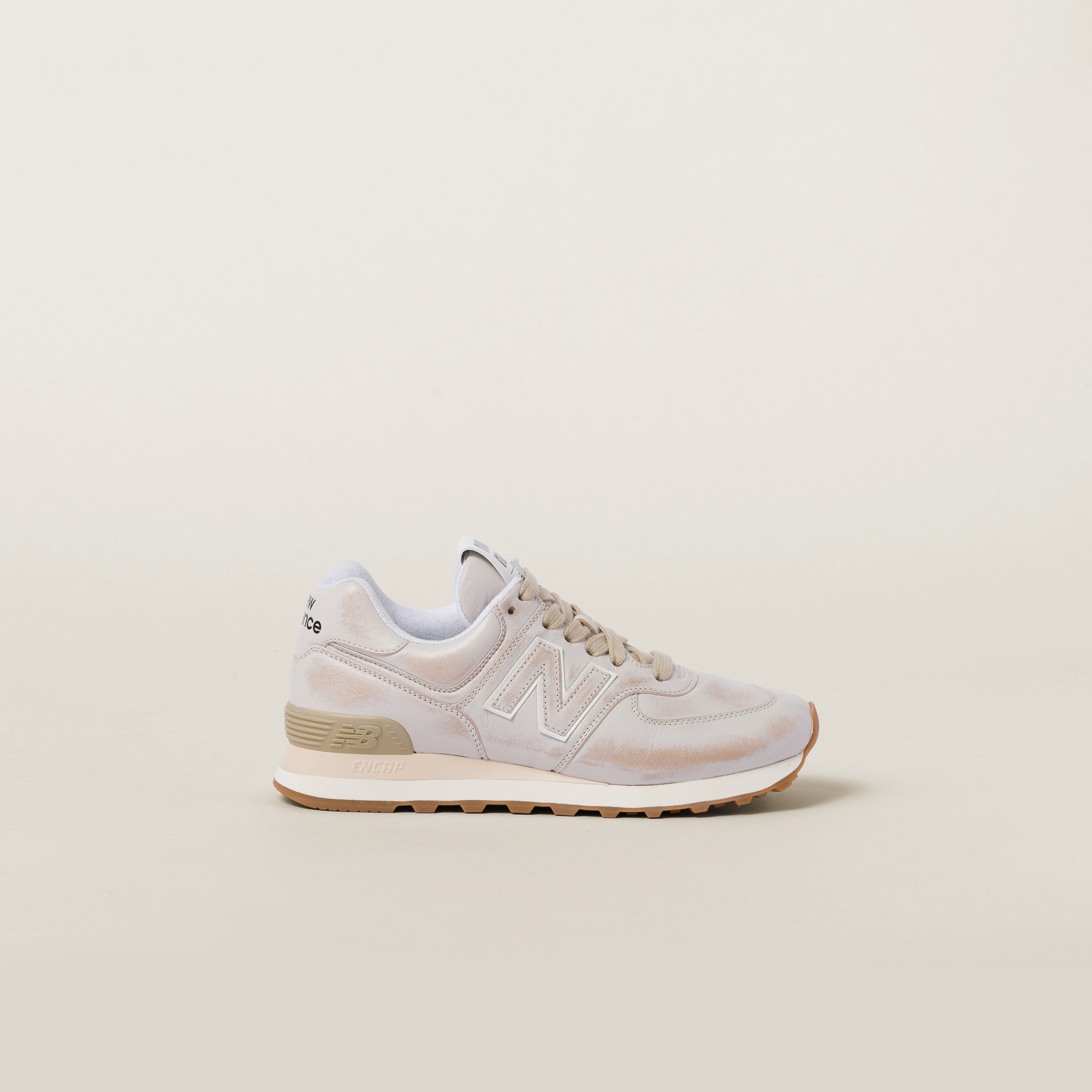 Miu Miu & New Balance's 574 sneaker collaboration with soft velvet & distressed leather uppers