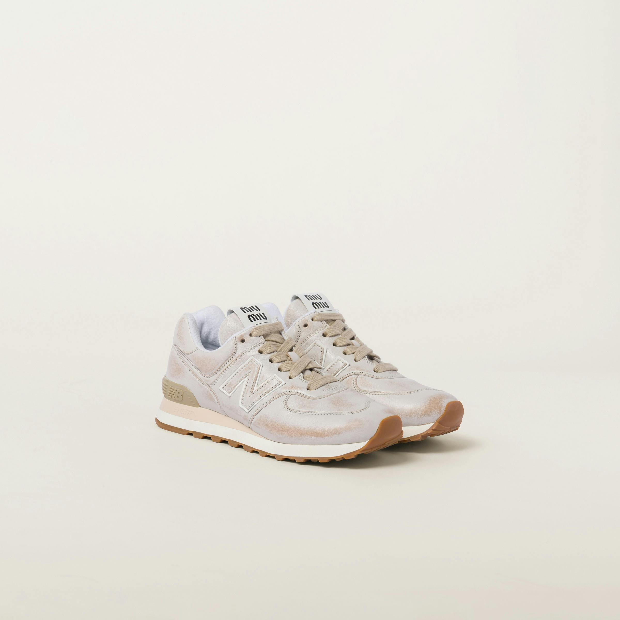 Miu Miu & New Balance's 574 sneaker collaboration with soft velvet & distressed leather uppers