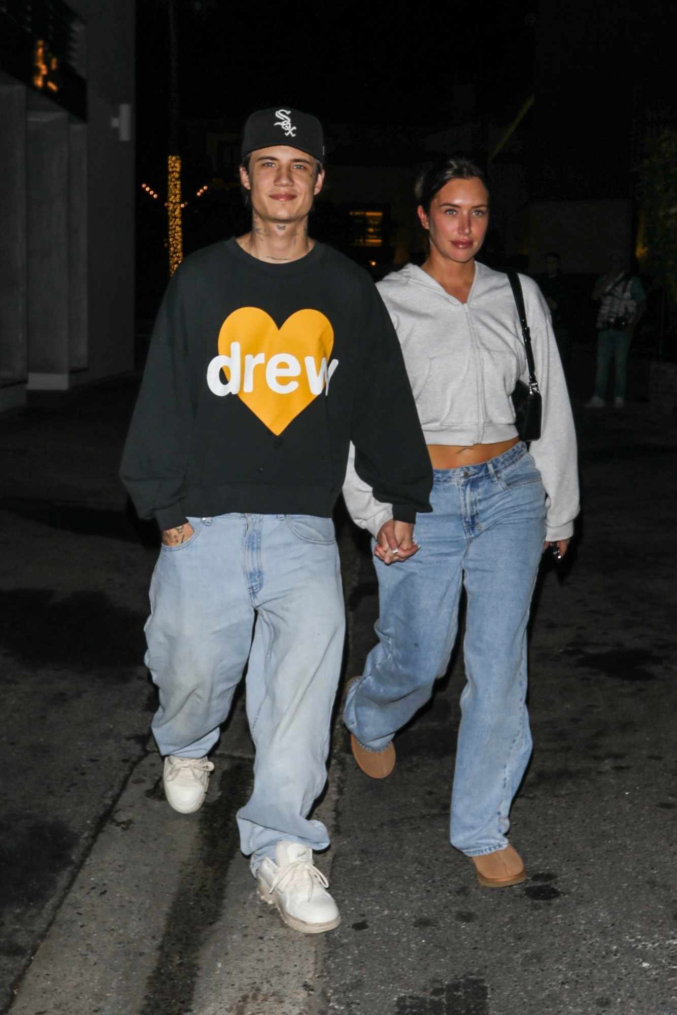 Stassie & boyfriendJaden Hossler wearing Drew House merch out at night to meet Justin & Hailey Bieber