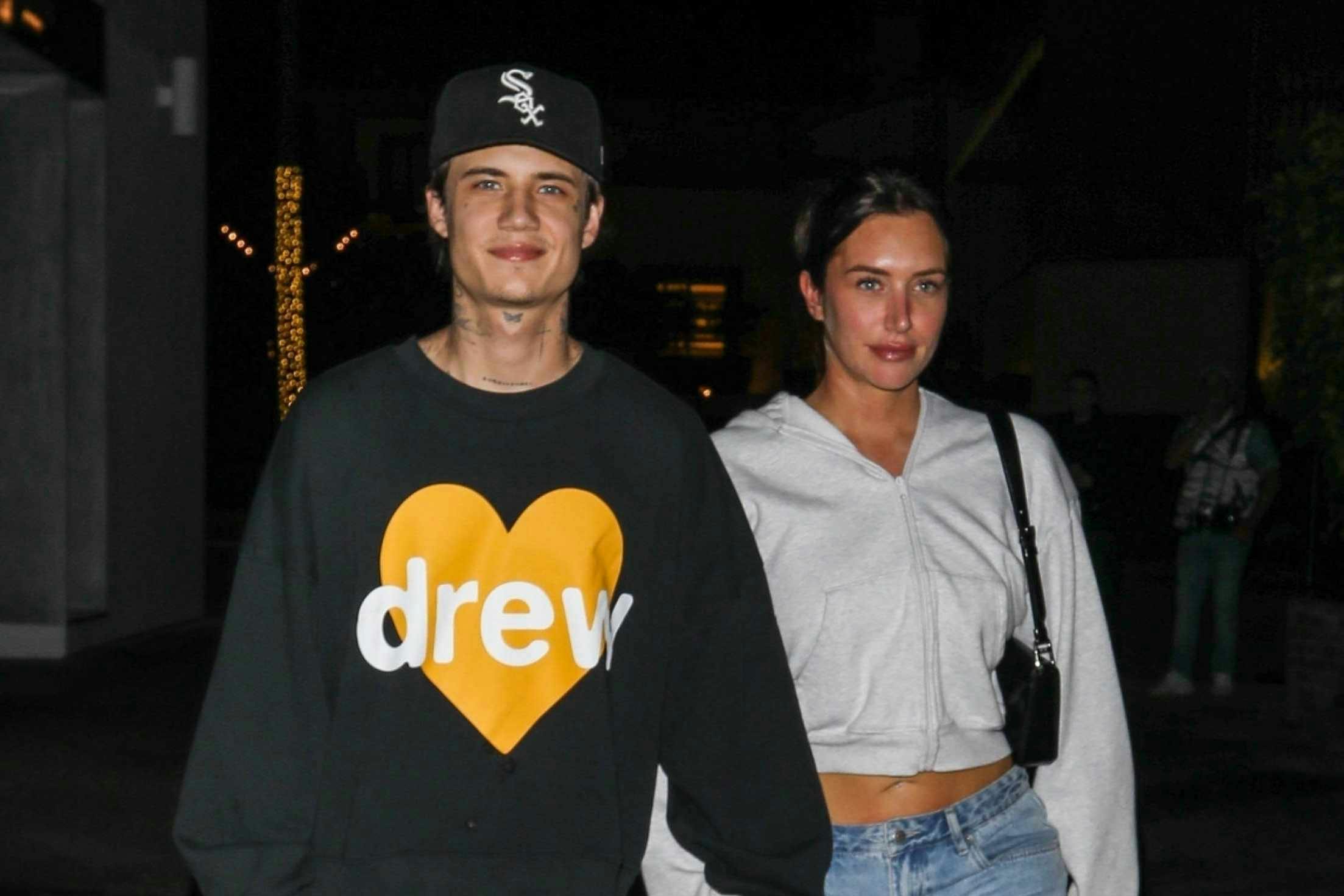 Stassie & boyfriendJaden Hossler wearing Drew House merch out at night to meet Justin & Hailey Bieber