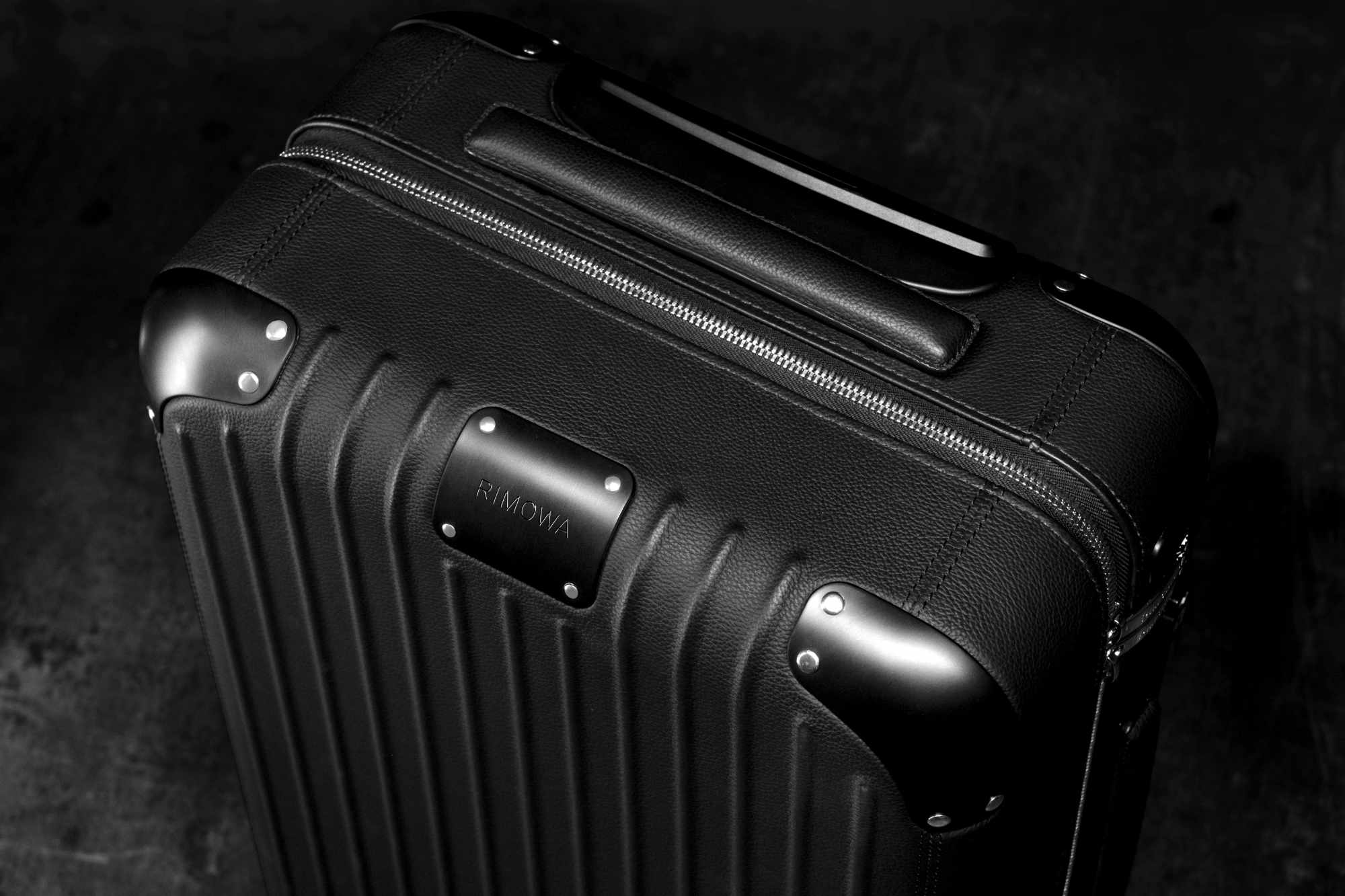 RIMOWA's $3,300 leather-wrapped Distinct Cabin suitcase collection