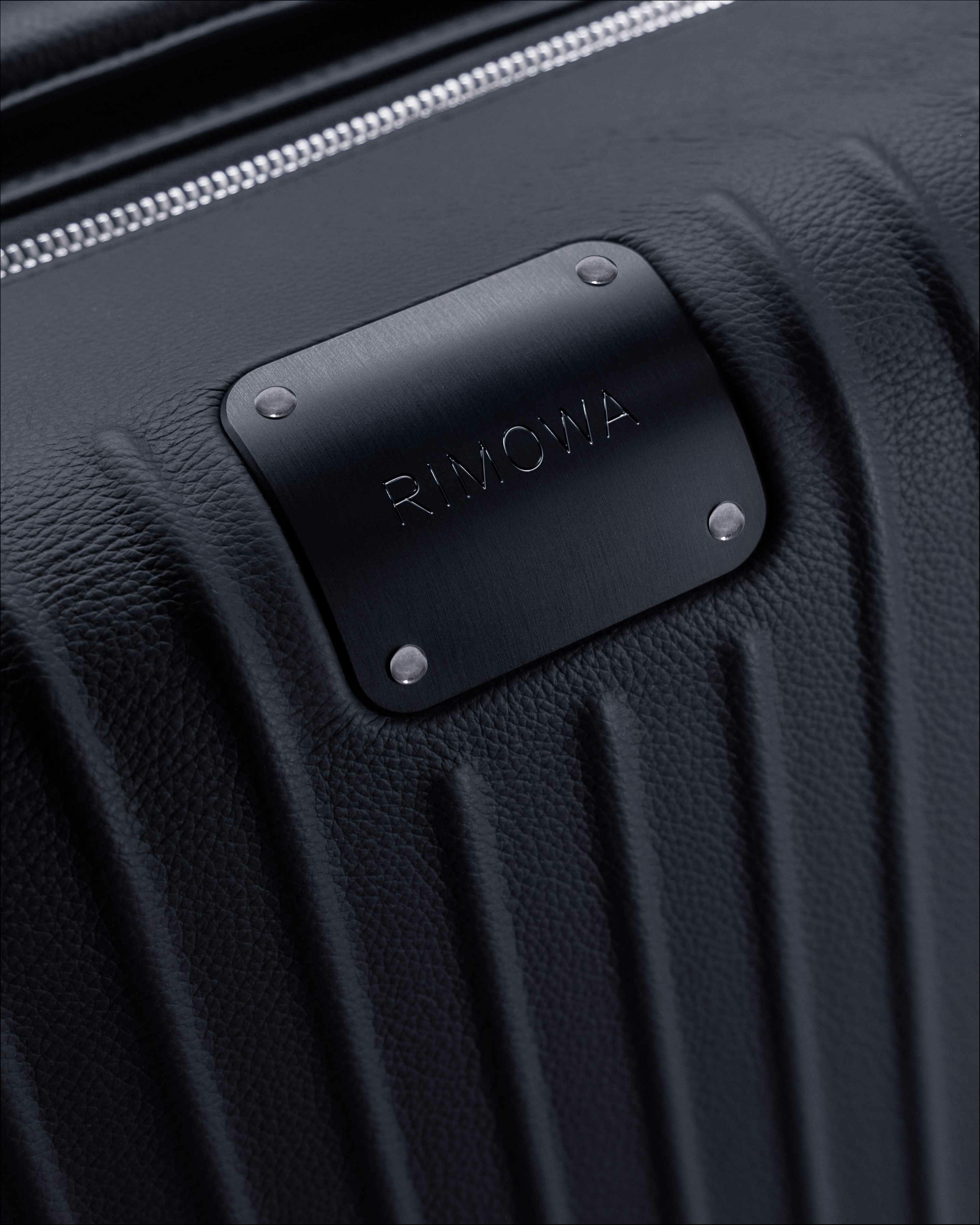 RIMOWA's $3,300 leather-wrapped Distinct Cabin suitcase collection