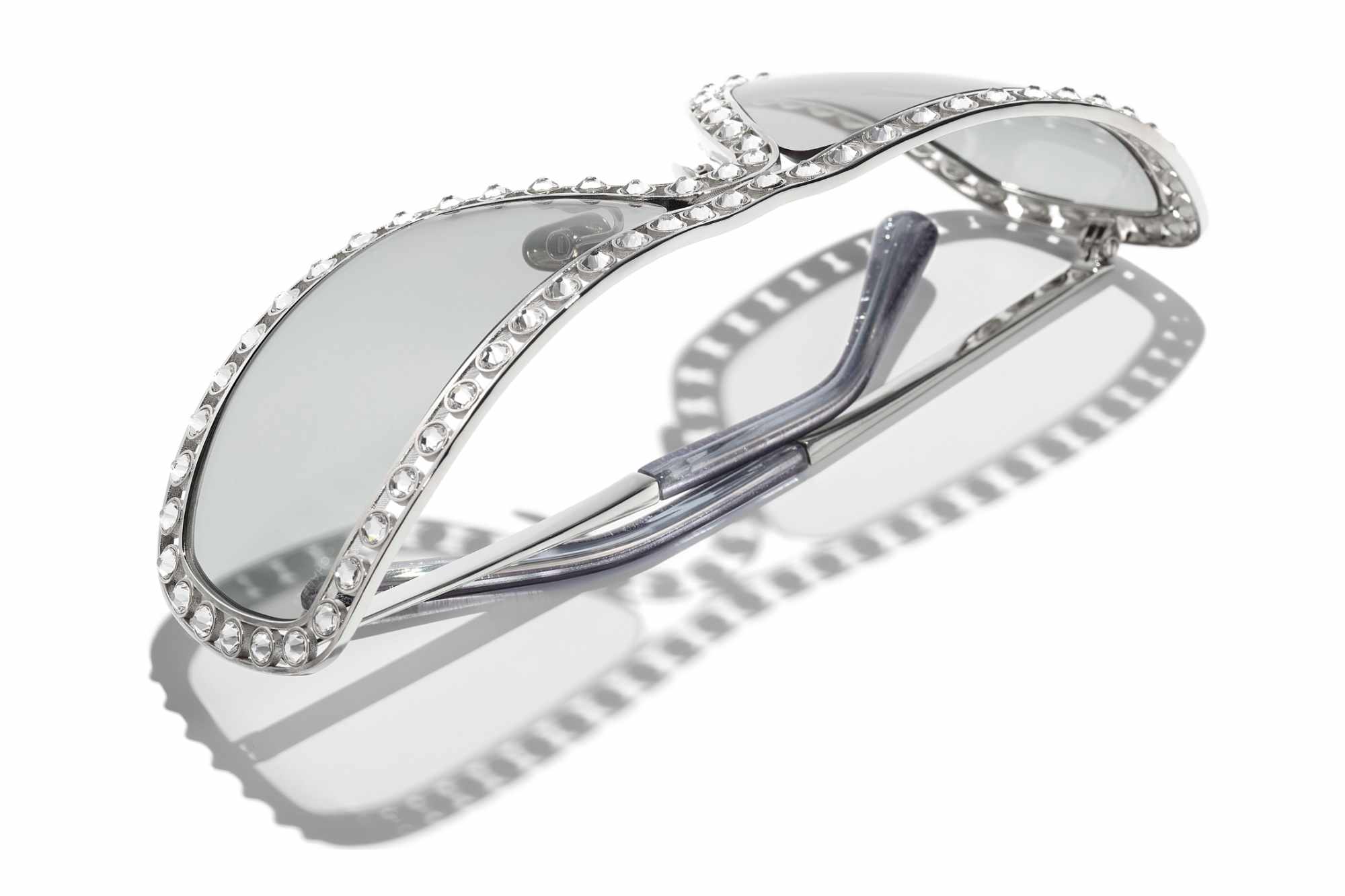 An angled photograph of Chanel's crystal shield sunglasses