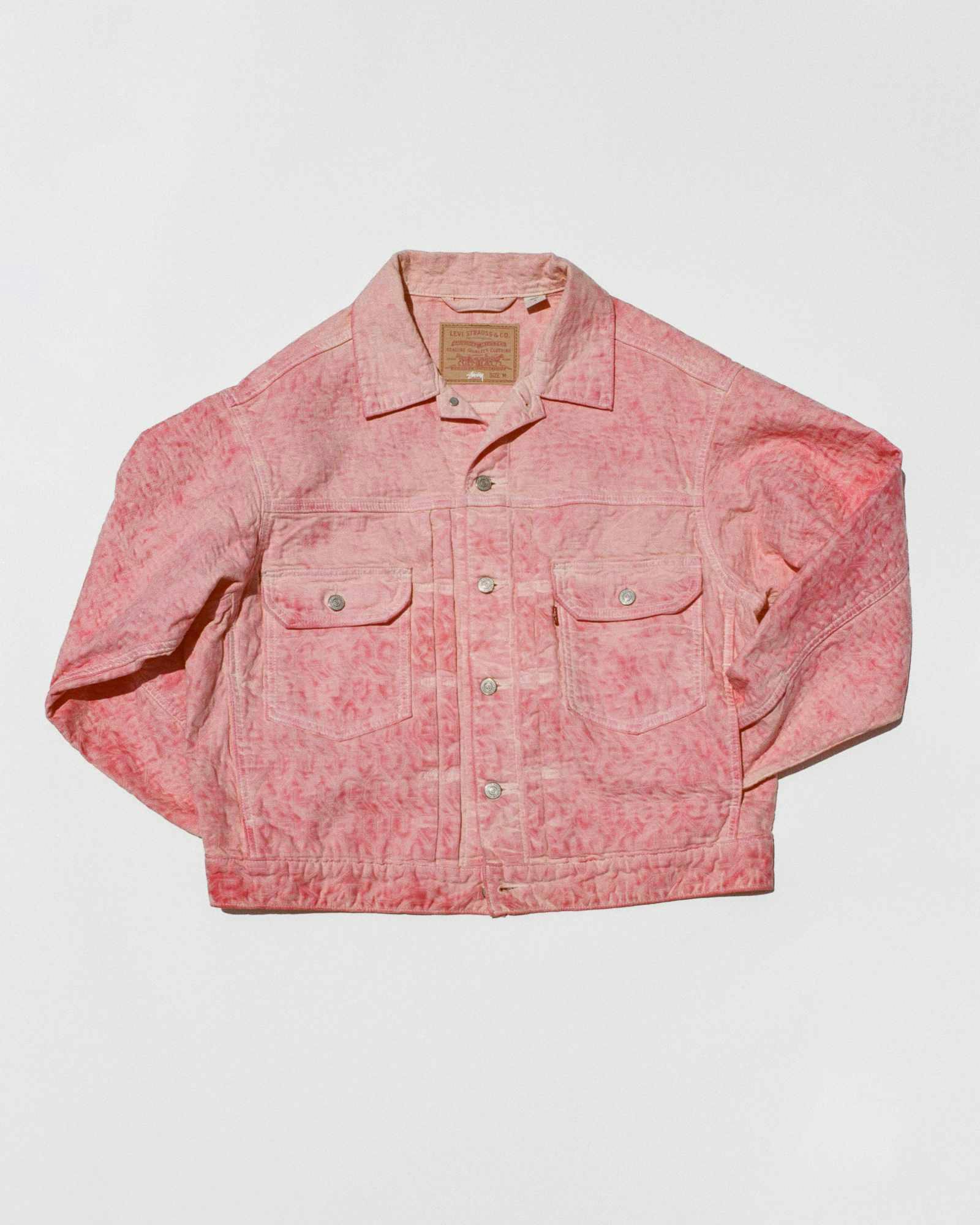Models wear Stussy & Levi's overdyed brown, beige, and grey denim trucker jackets and 501 jeans