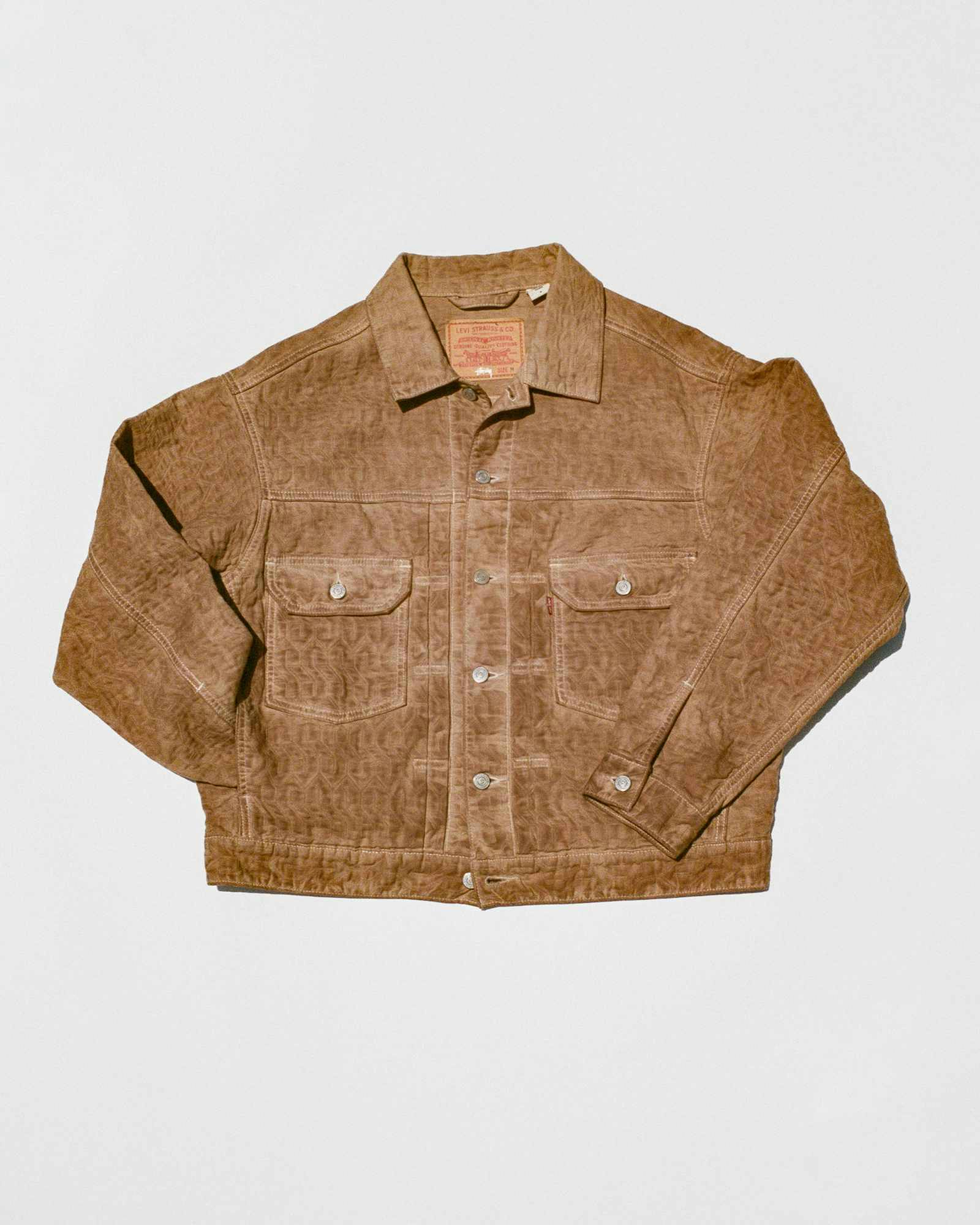 Models wear Stussy & Levi's overdyed brown, beige, and grey denim trucker jackets and 501 jeans