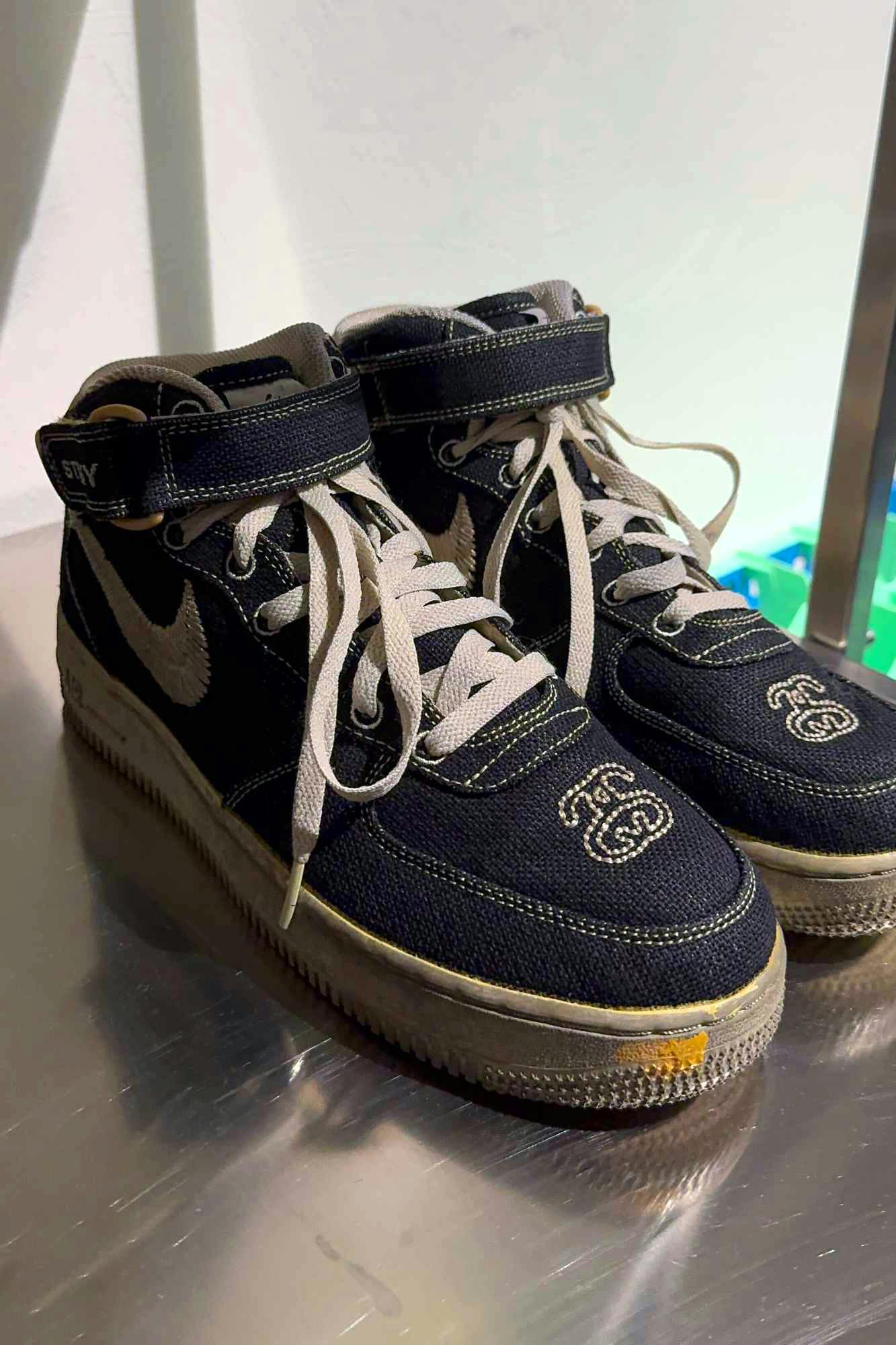 In-hand photos of Stussy & Nike's dyed Air Force 1 Mid sneaker