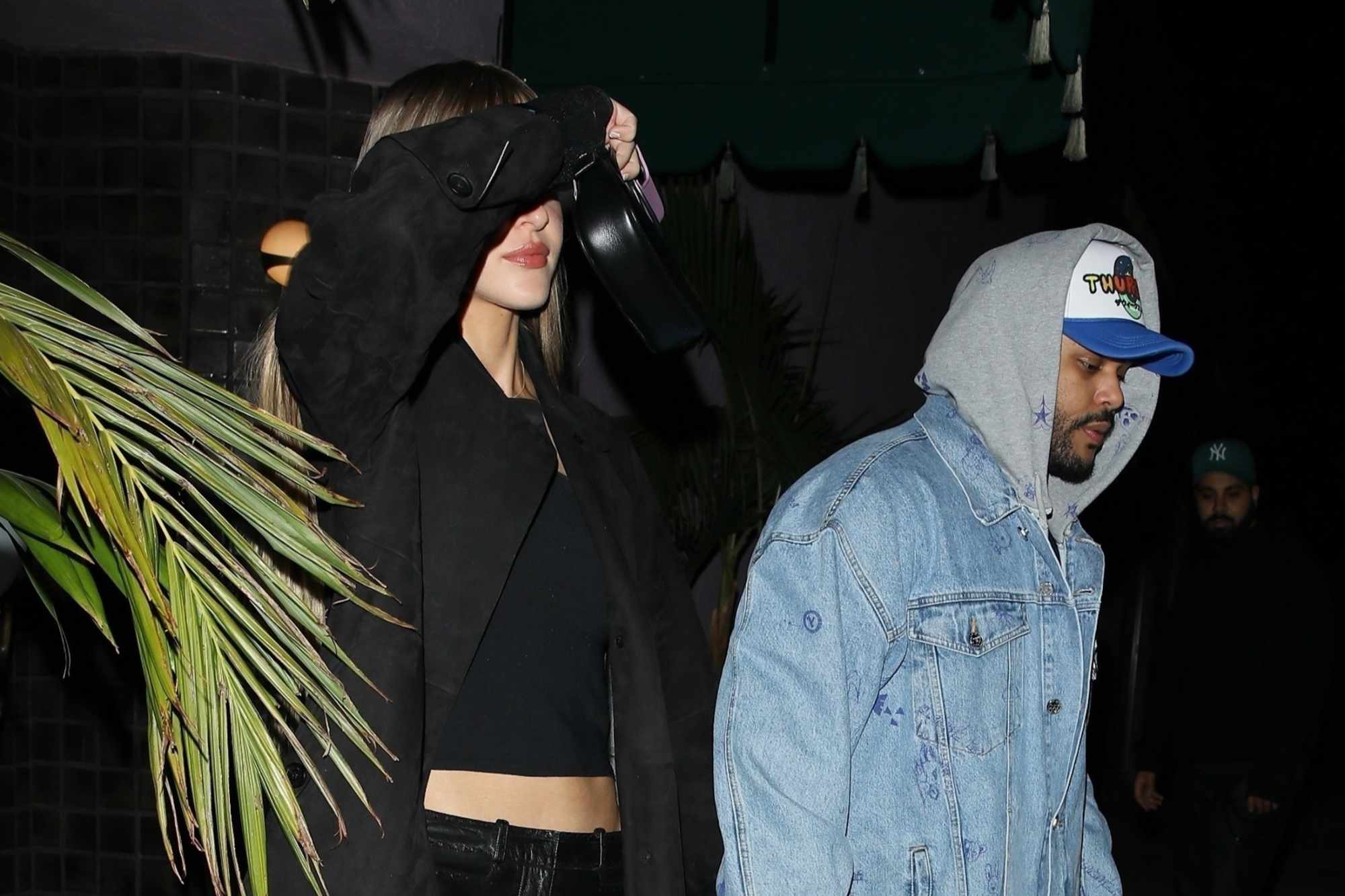 The Weeknd & Simi Khadra seen out in Beverly hills wearing a black jacket & pants and a denim jacket and jeans