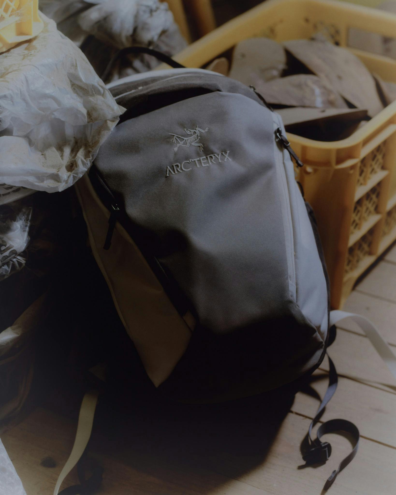 Photos of BEAMS & Arc'teryx's November 2023 collab clothing & bags in grey, black, and white patchwork