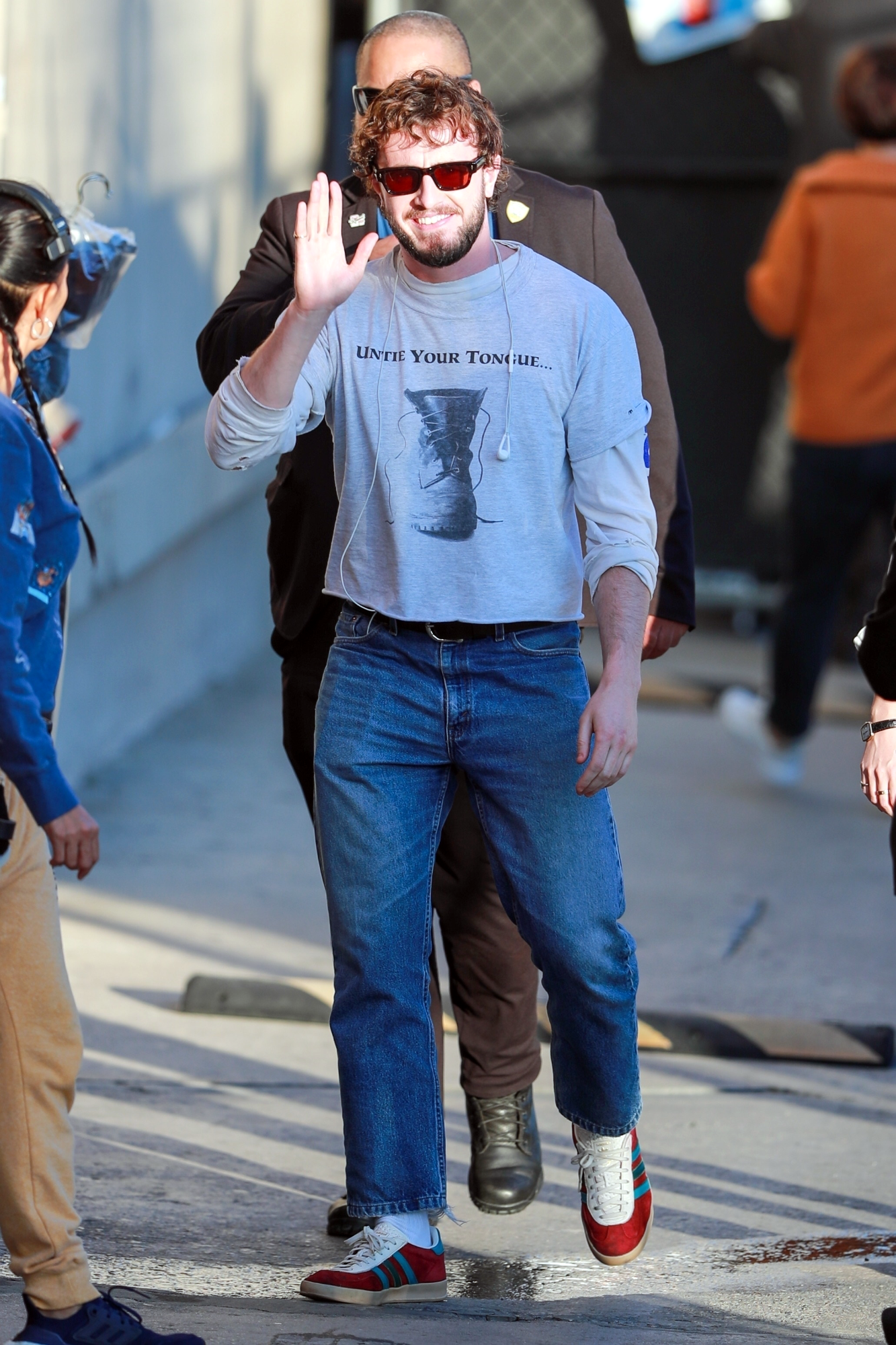 Paul Mescal wears a crop stop sweater with jeans & adidas sneakers to Jimmy Kimmel