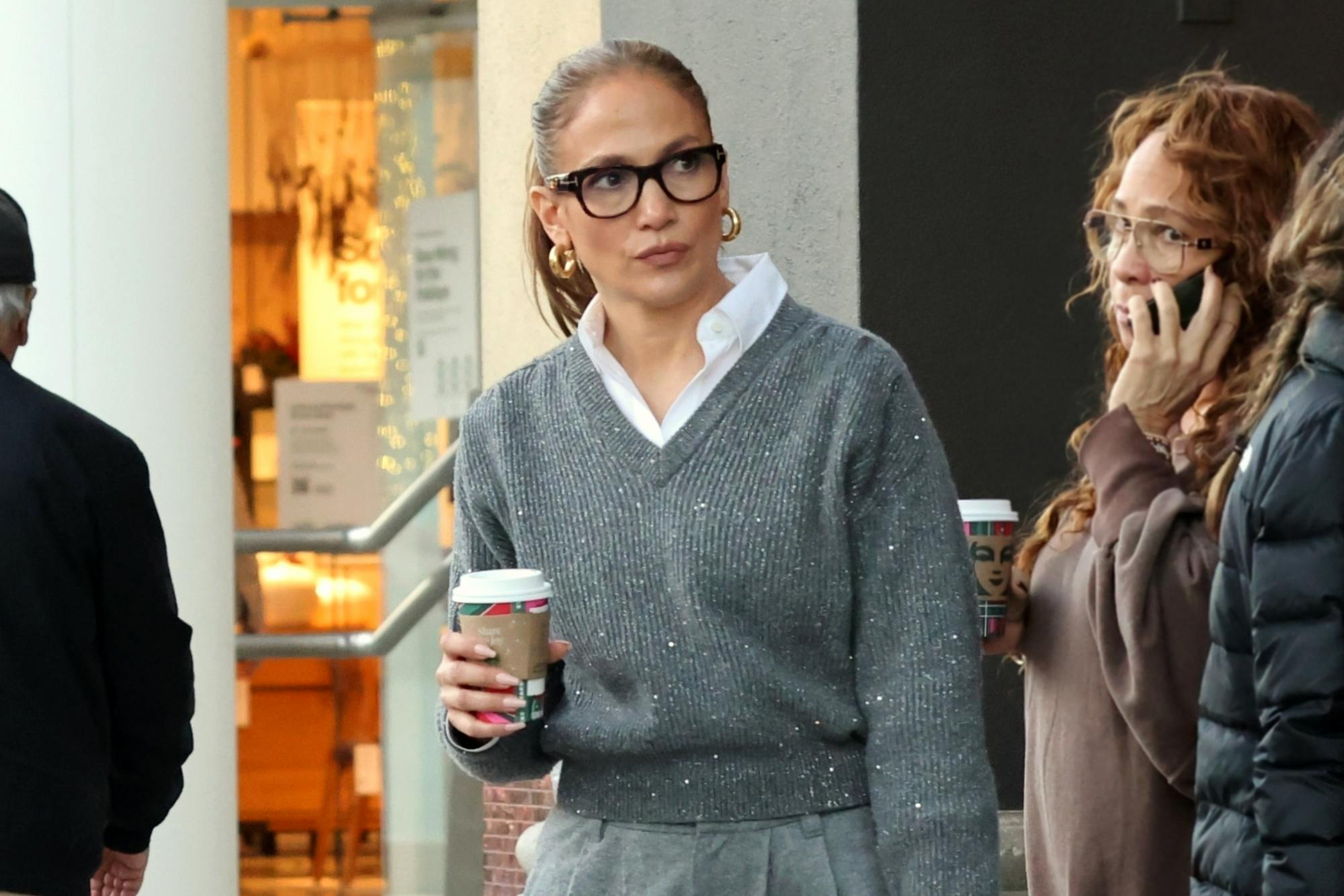 JLo wears a grey sweater, pleated pants, white shirt & Hermes Birkin bag