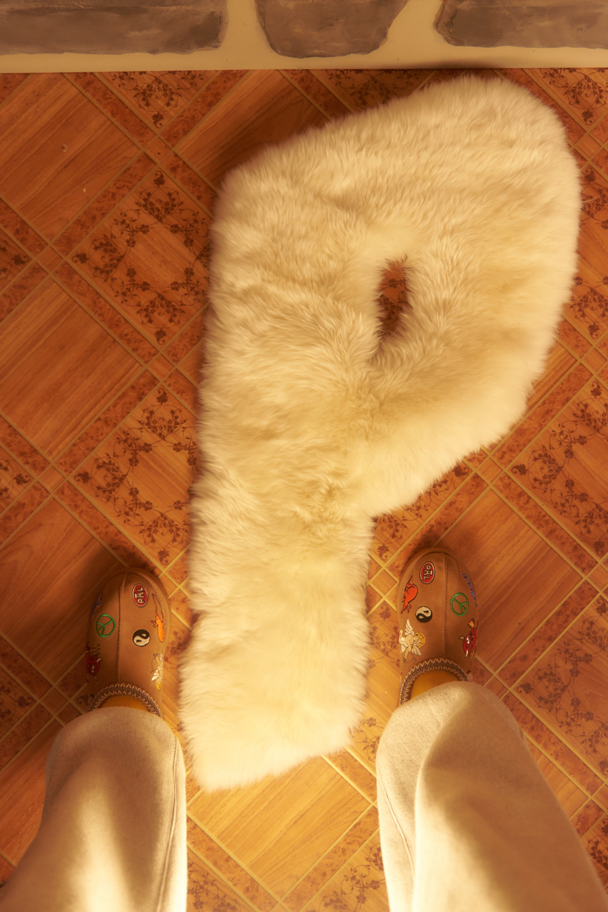 Palace & UGG are collaborating for Fall/Winter 2023 for a take on the latter's Tasman slip-ons, mittens & a P-shaped sheepskin rug, of course.