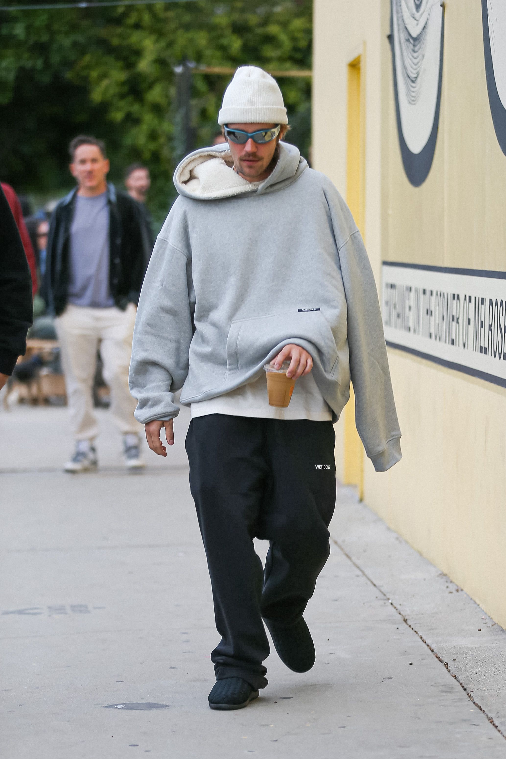 Justin Bieber Wearing a Hoodie With One Sleeve Dangling