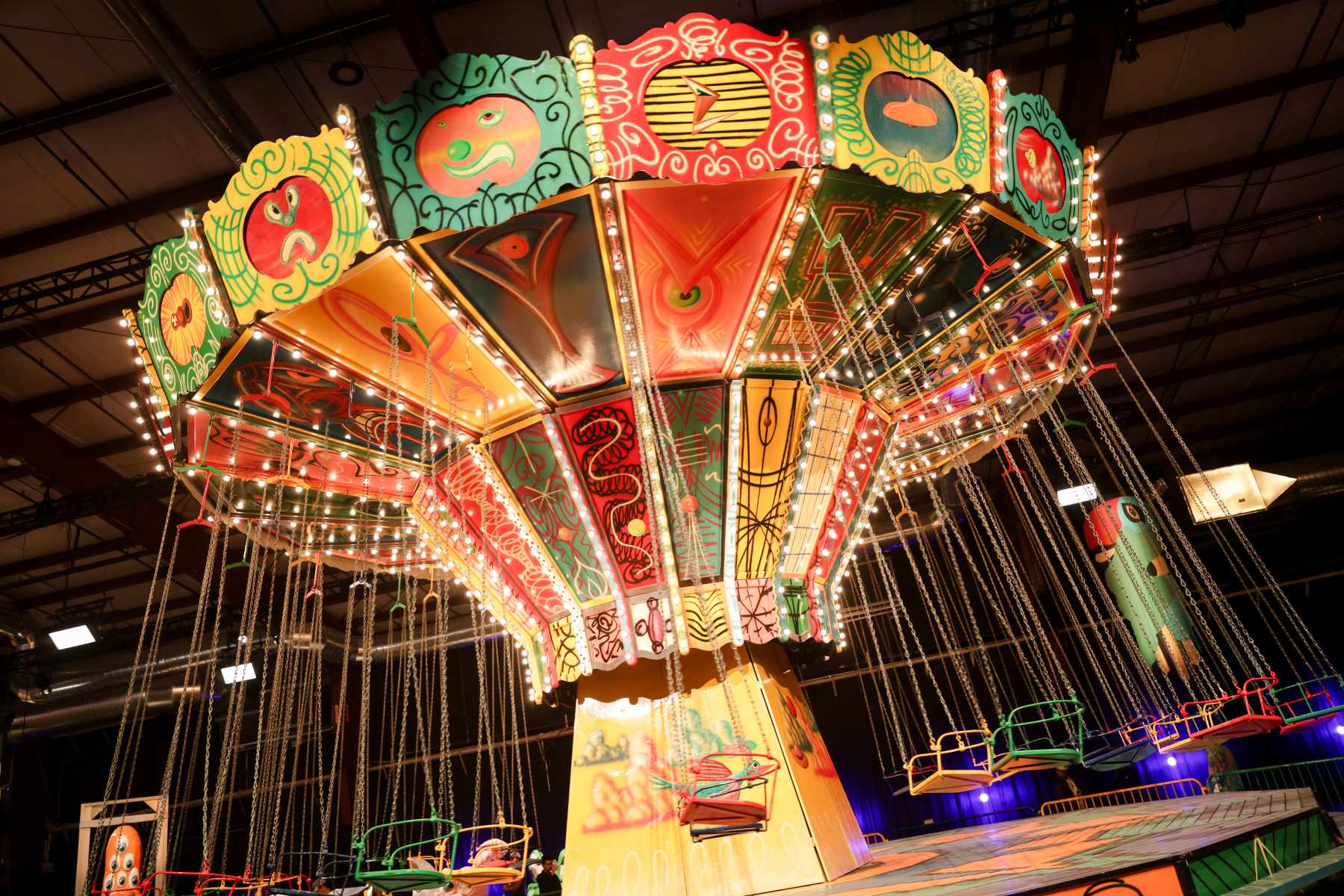 Attendees walk through Luna Luna art amusement park in December 2023