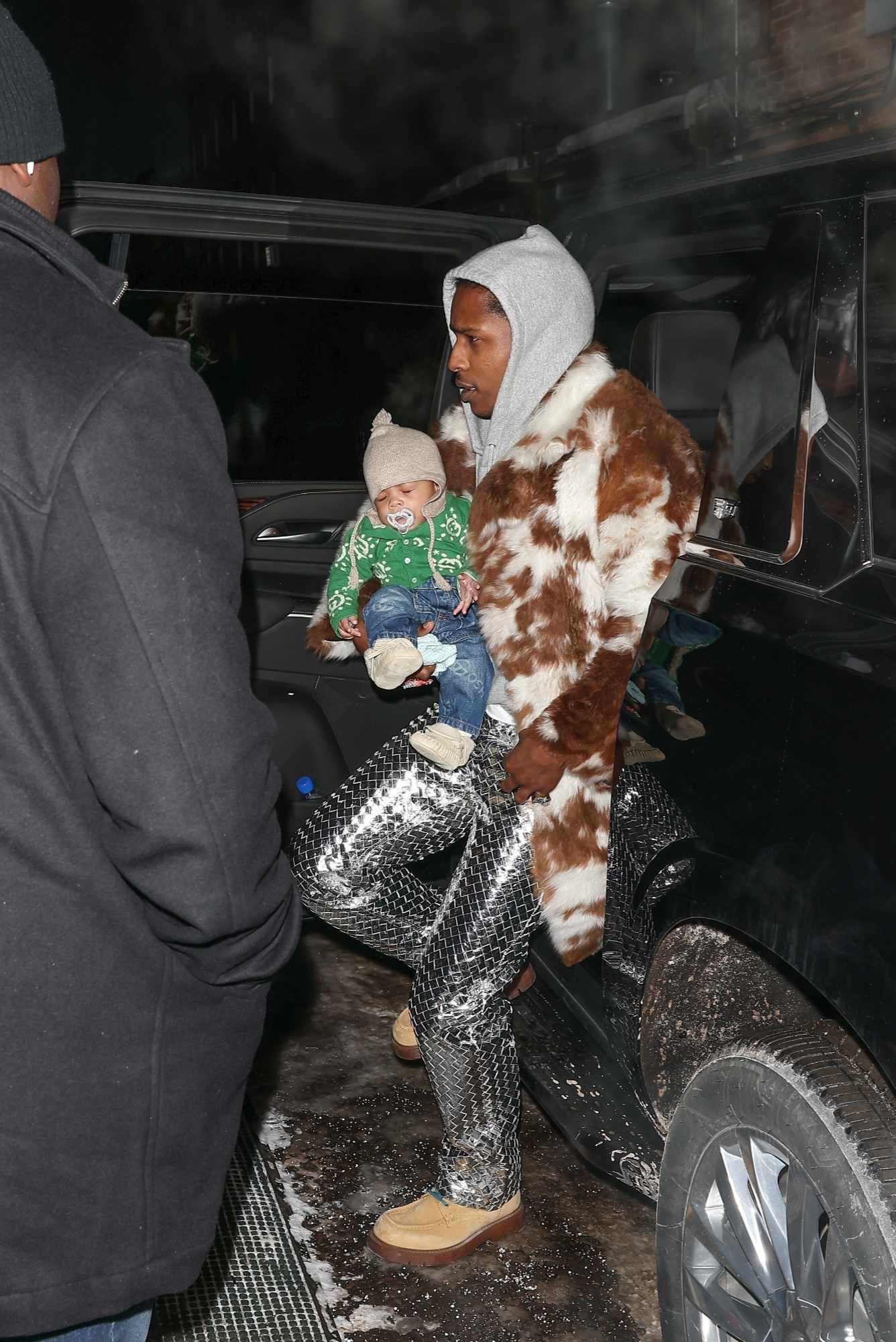 A$AP Rocky & Rihanna seen in Aspen on a ski trip wearing Bottega Veneta boots with their two sons