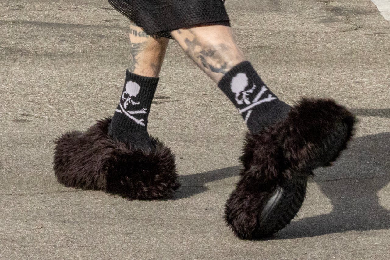 Travis Barker spotted grabbing a coffee wearing Balenciaga's Crocs collaboration.