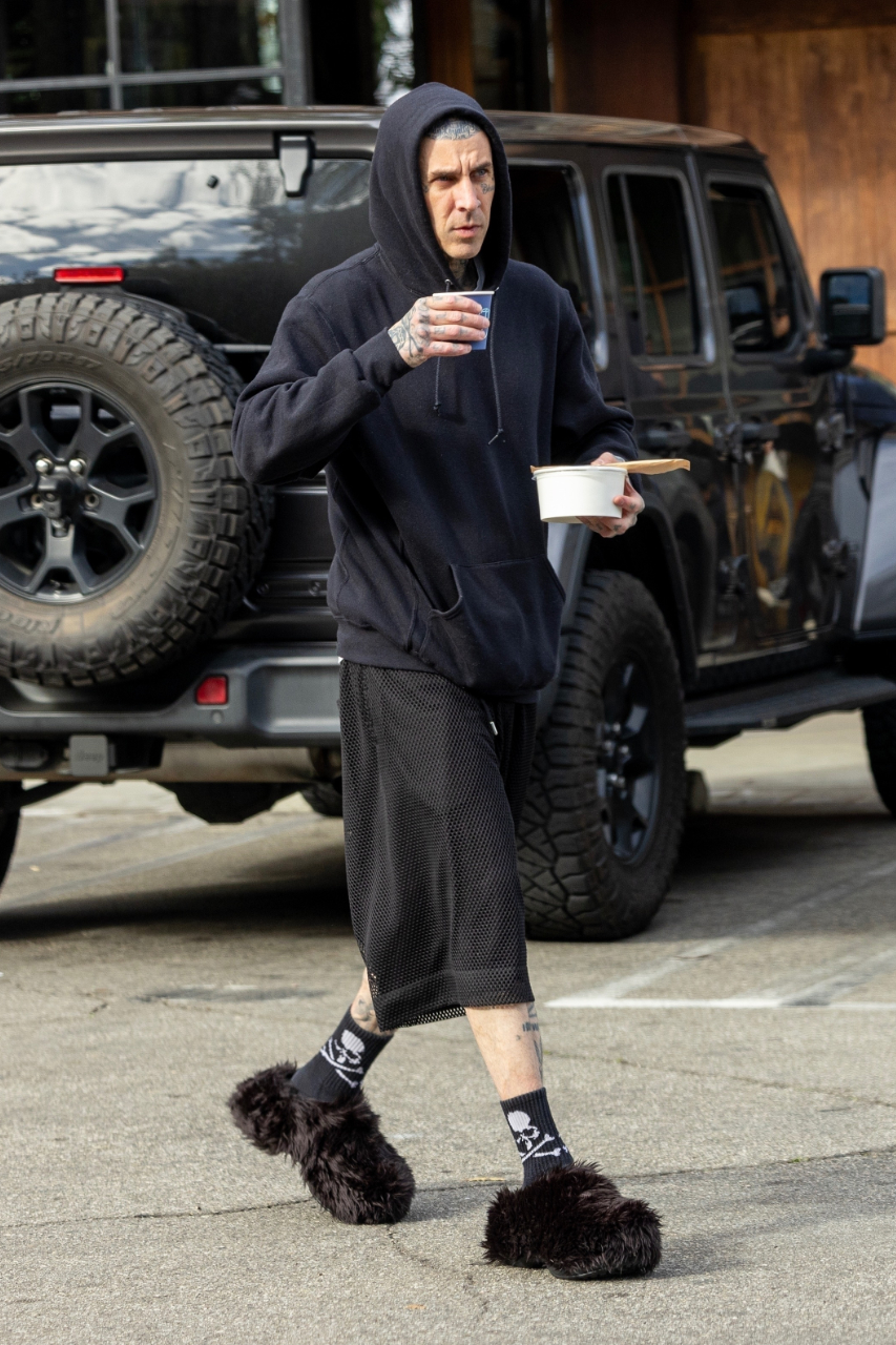 Travis Barker spotted grabbing a coffee wearing Balenciaga's Crocs collaboration.