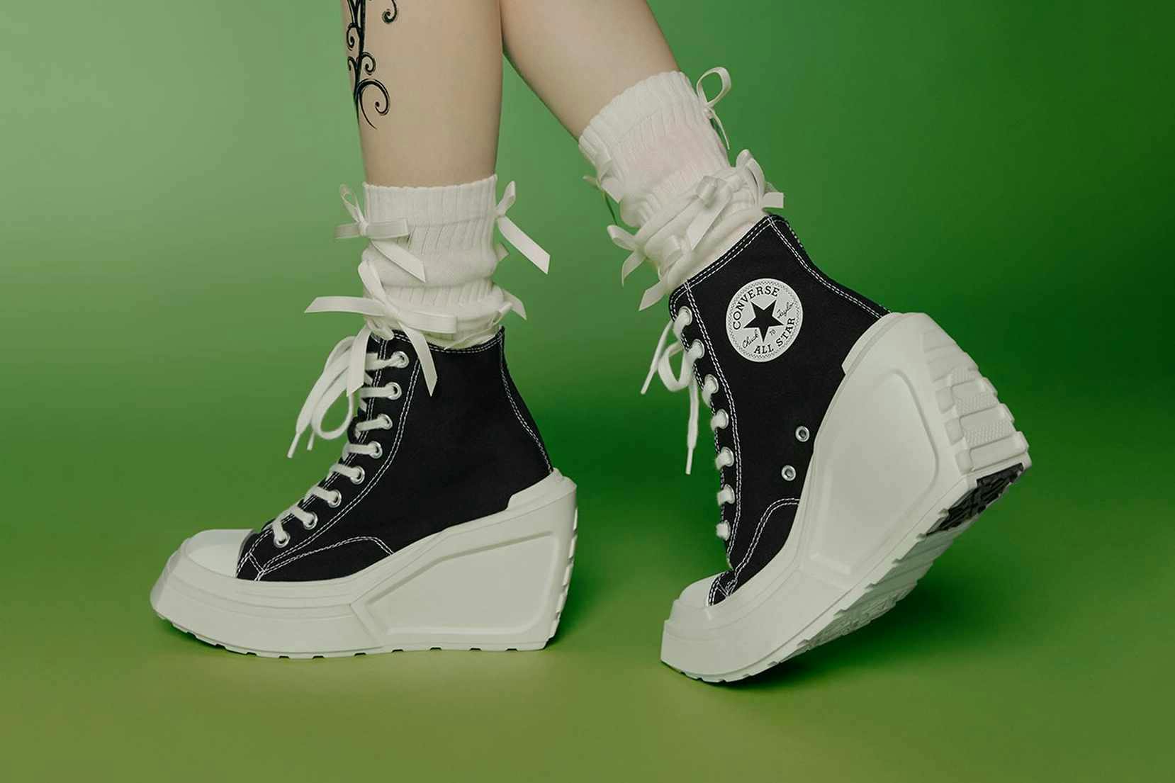 Converse's de luxe wedge heel sneaker in black and white worn by AESPA member Karina