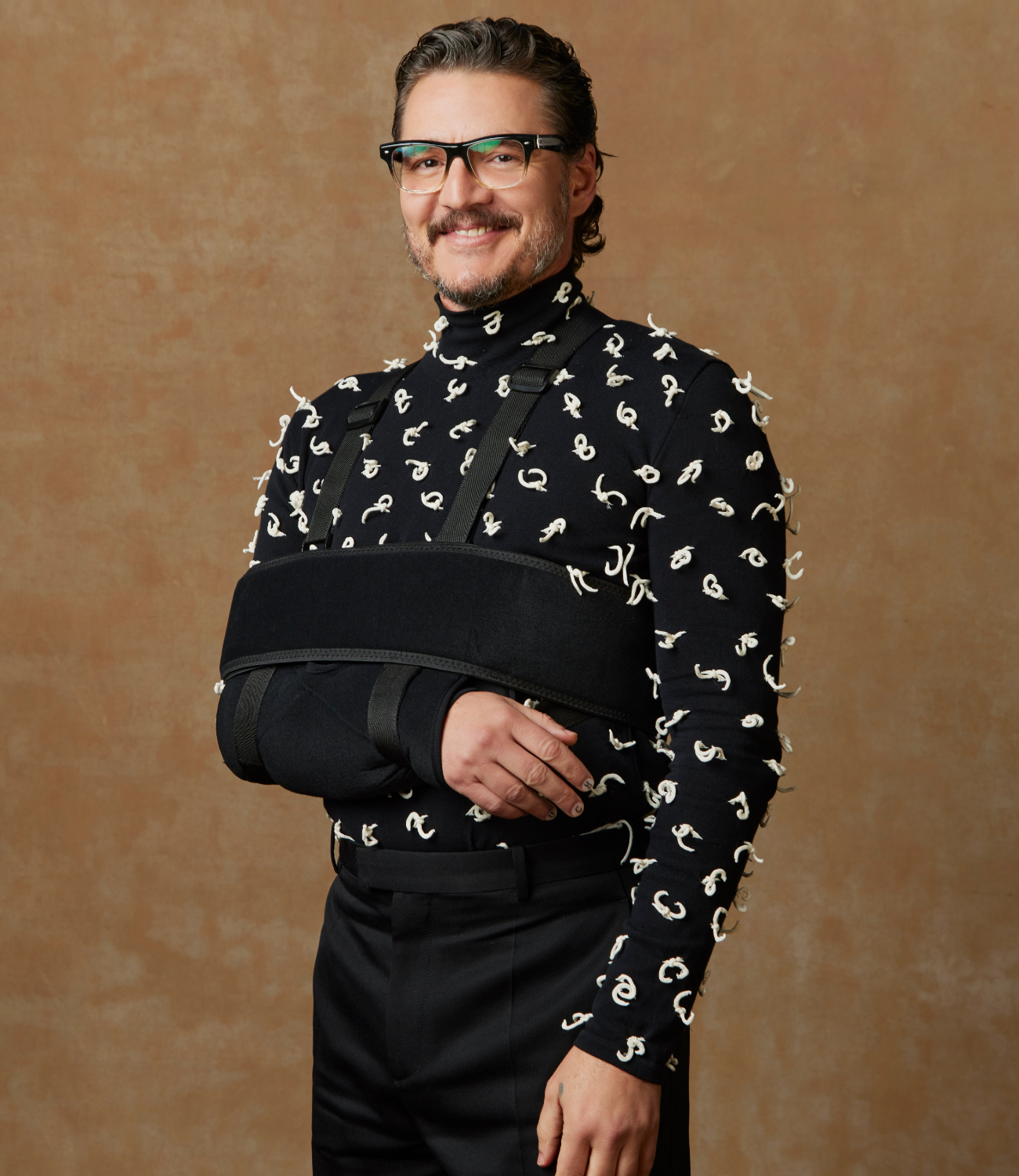 Pedro Pascal at the portrait booth at the 81st Golden Globe Awards held at the Beverly Hilton Hotel.