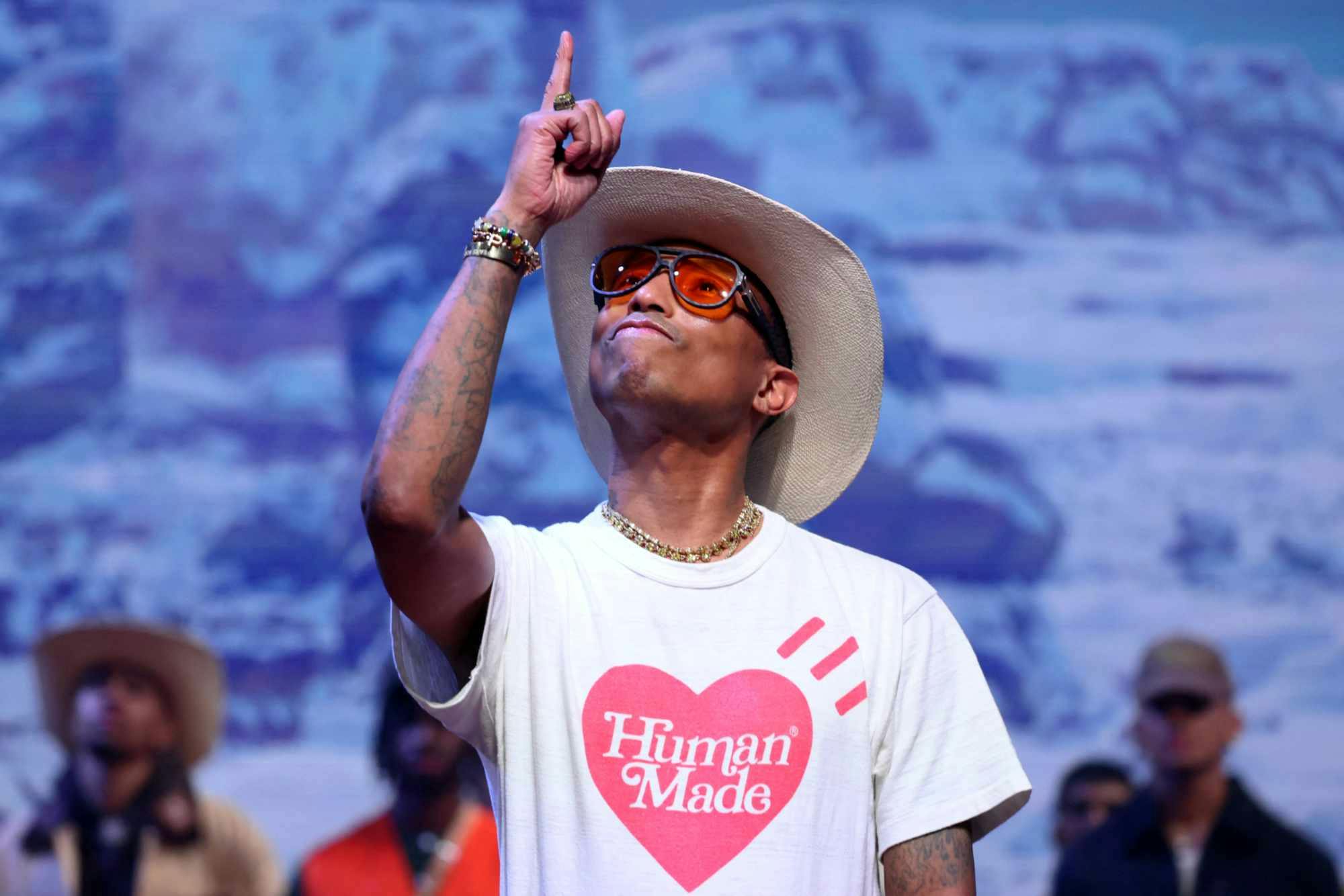 Pharrell Williams points at Louis Vuitton's Fall/Winter 2024 menswear runway show in Paris