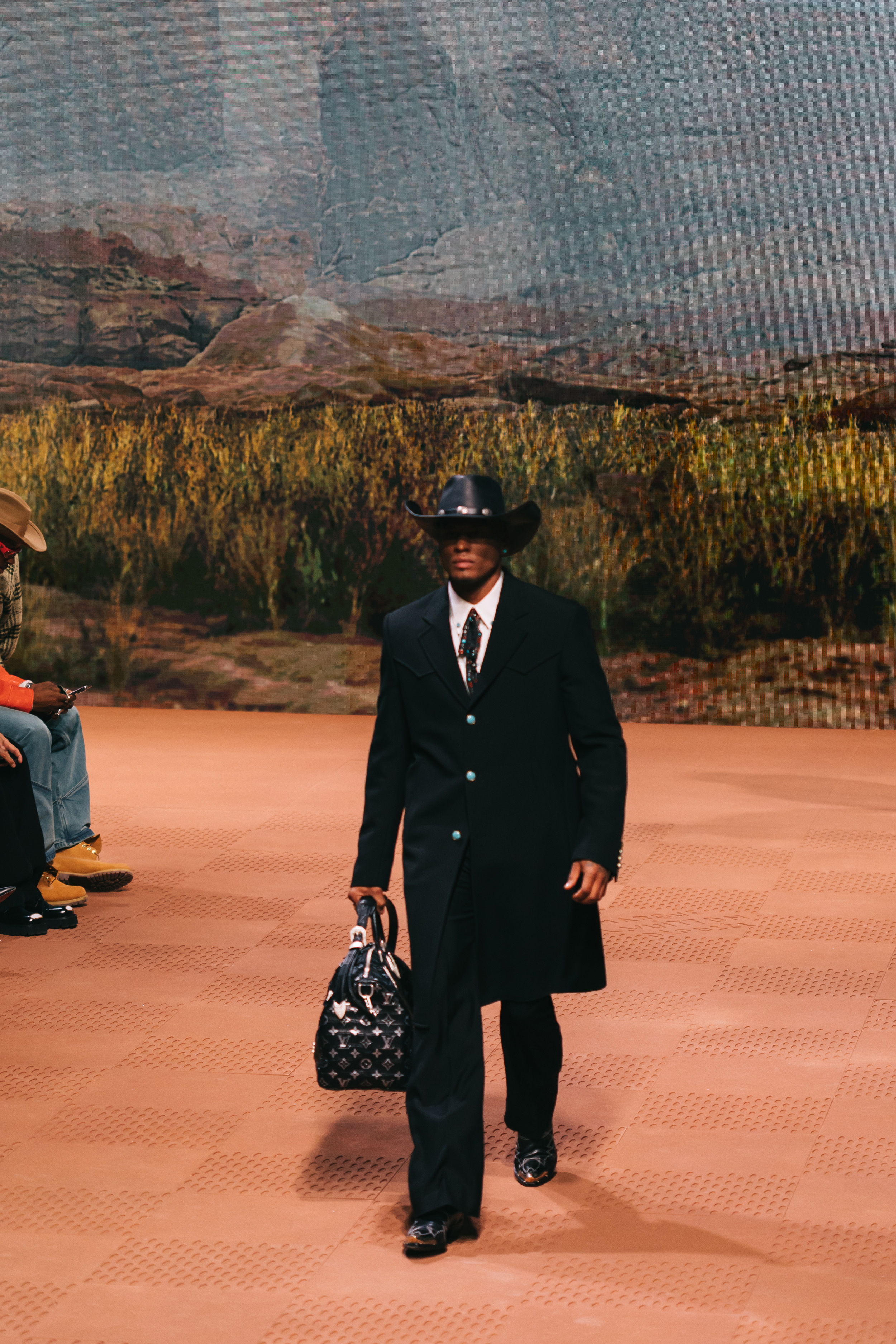Models wear Pharrell's Louis Vuitton FW24 menswear collection
