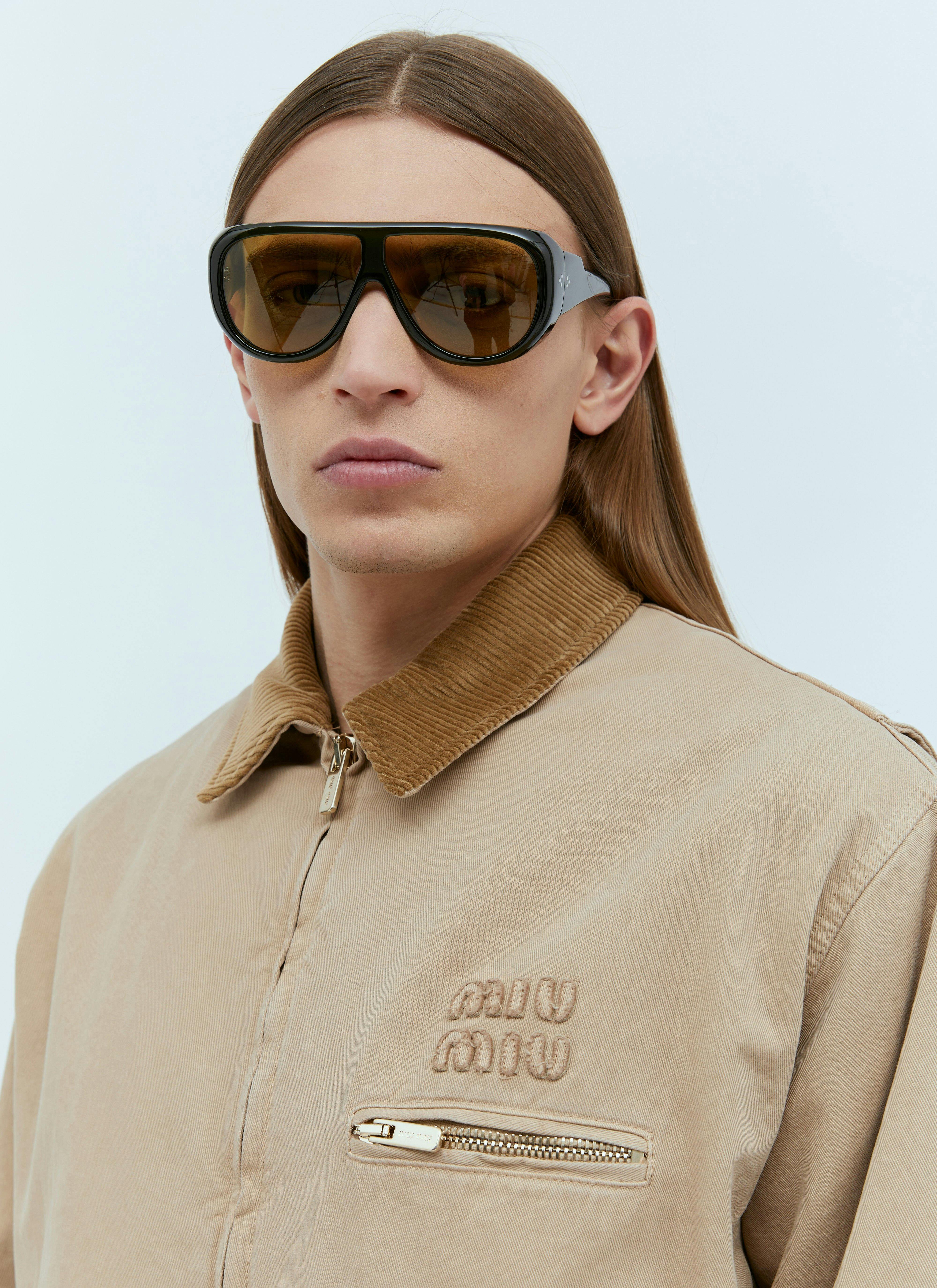 A model wears a Miu Miu menswear jacket