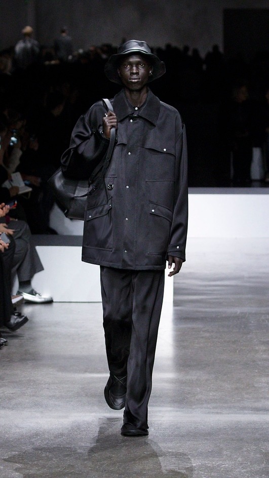 A model wears a Fendi menswear Carhartt-inspired jacket