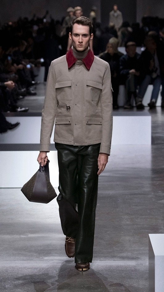 A model wears a Fendi menswear Carhartt-inspired jacket