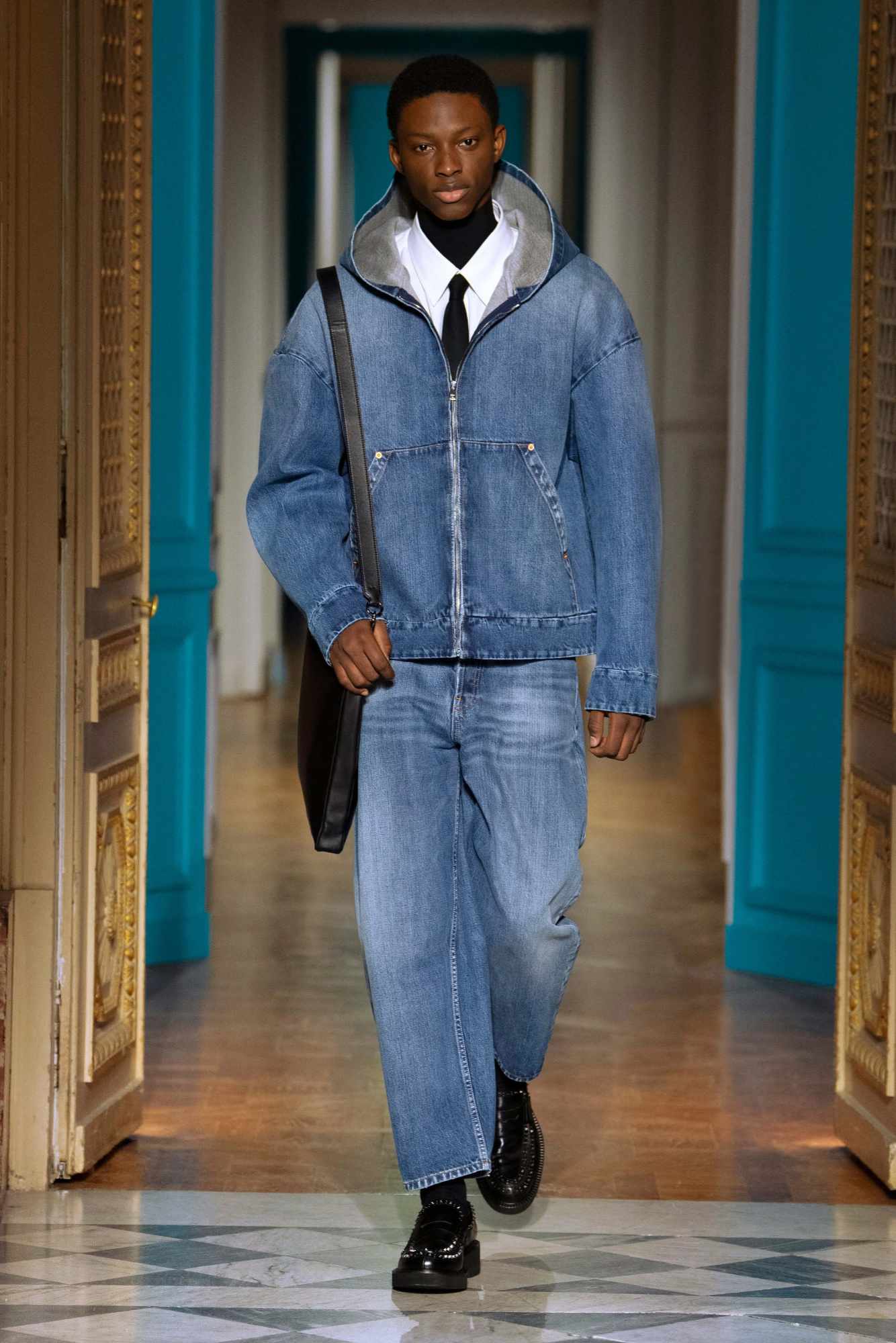 A model wears a Valentino menswear Carhartt-inspired jacket