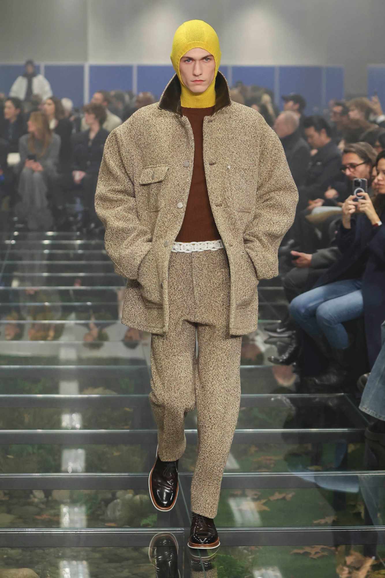 A model wears a Prada menswear Carhartt-inspired jacket