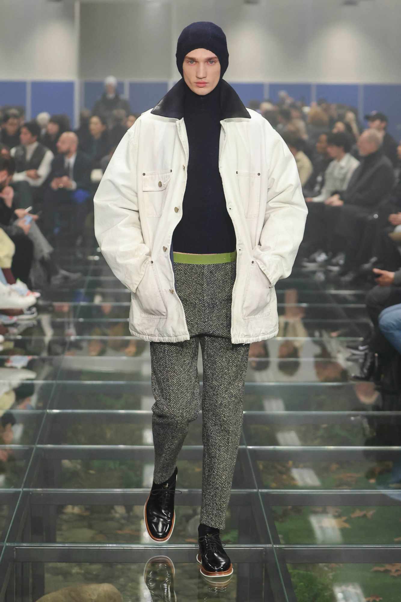 A model wears a Prada menswear Carhartt-inspired jacket