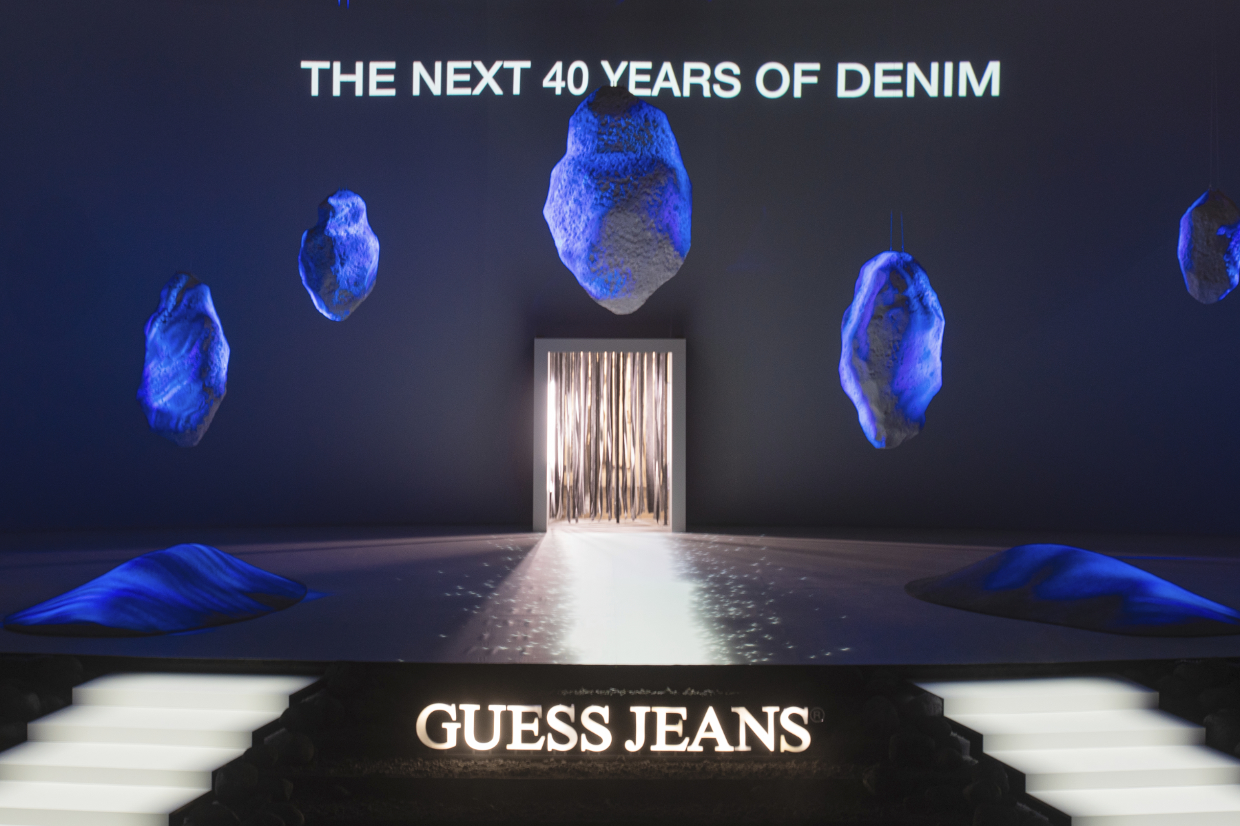 Stage with a Guess Jeans Logo displayed during an activation at Pitti Uomo
