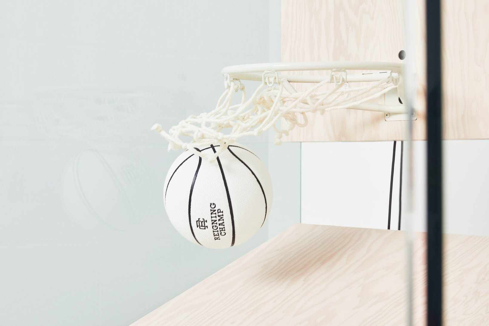 Reigning Champ's $50,000 basketball arcade game, made of natural hardwood & including a white basketball