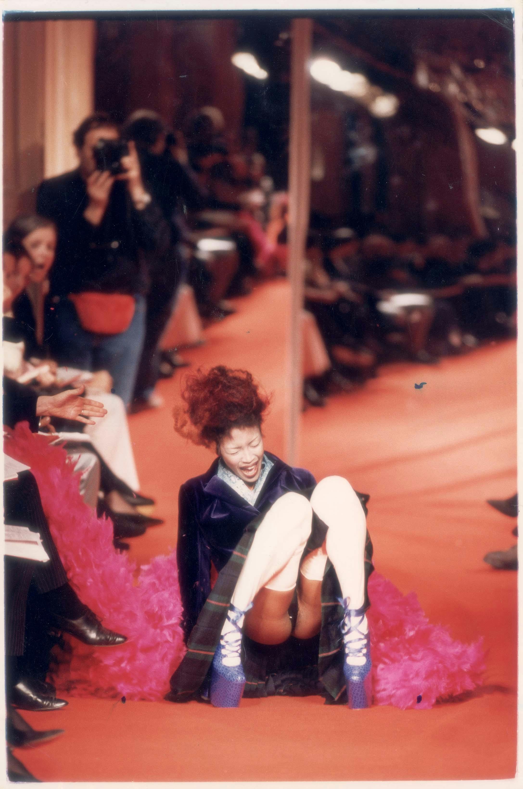 Naomi Campbell falls at the Vivienne Westwood Fall/Winter 1993 ready-to-wear fashion show.