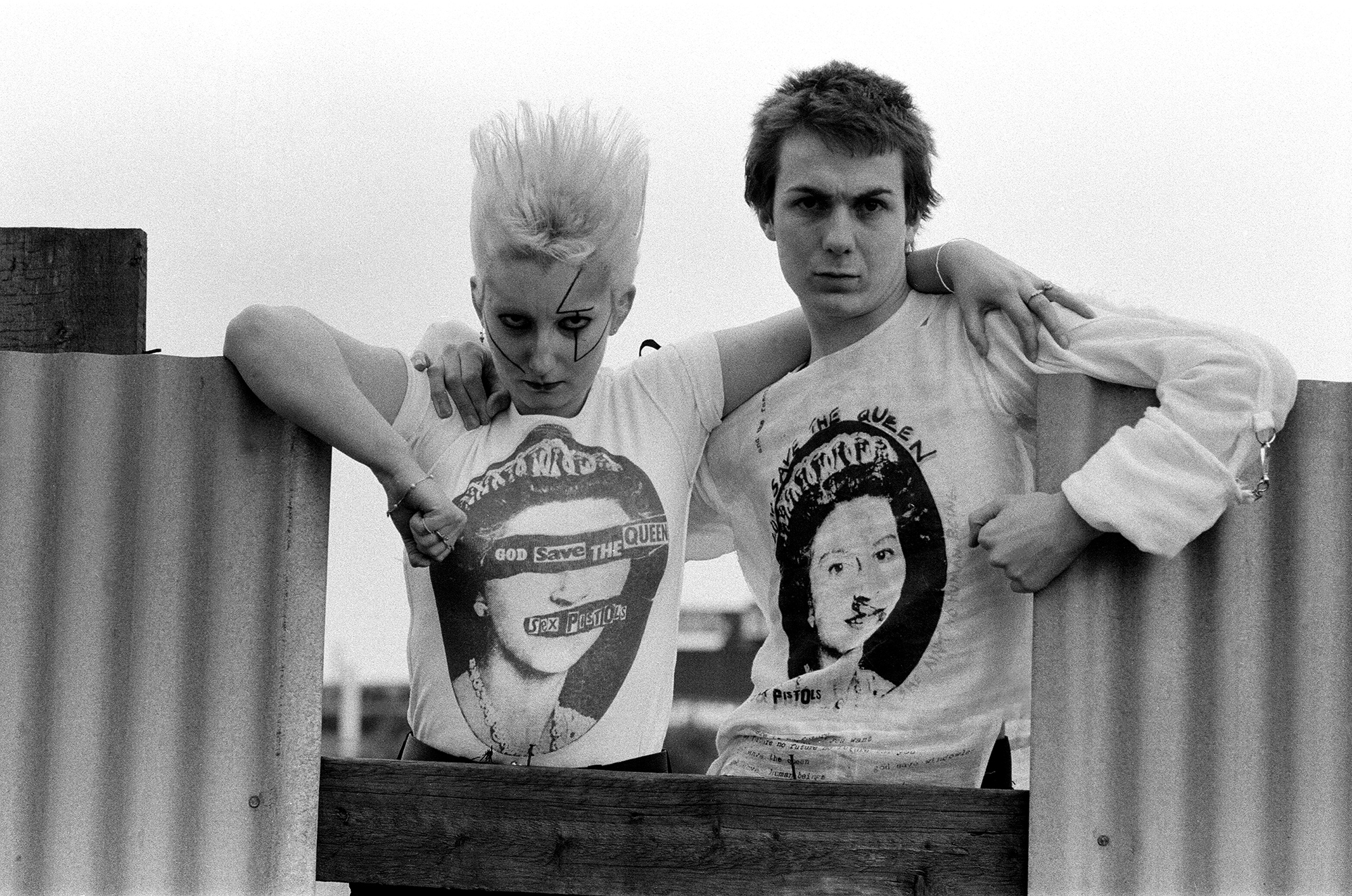 Models Jordan and Six wear the Sex Pistols’ “God Save the Queen” T-shirts from Westwood and Malcolm McLaren’s Sex boutique on King’s Road, London, 1977.