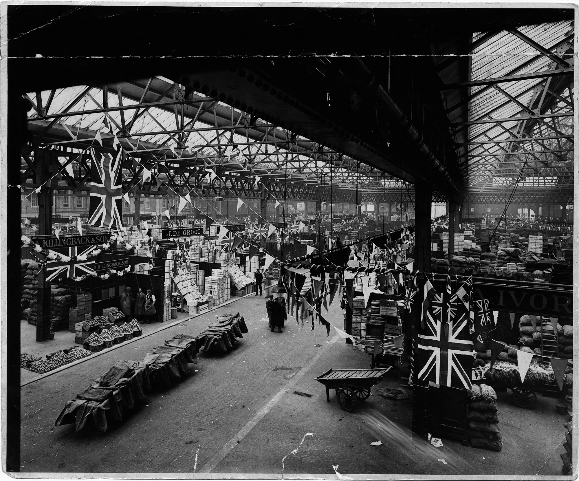 Union Jack flags and bunting in Old Spitalfields Market, 1928.