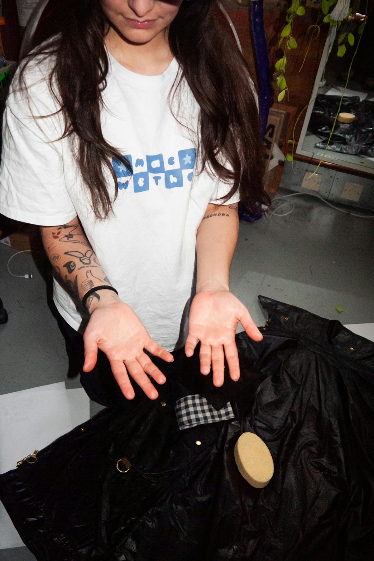 Dani posing with her Barbour jacket during the re-waxing process