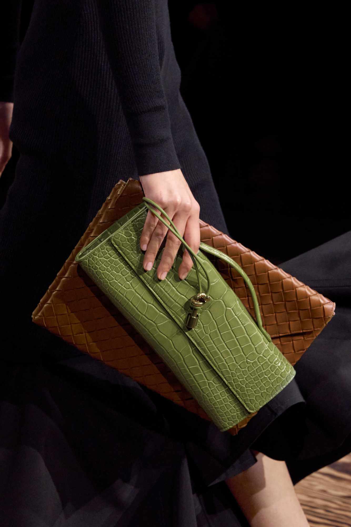 Models wear Bottega Veneta's green Fall/Winter 2024 clothes during Milan Fashion Week FW24