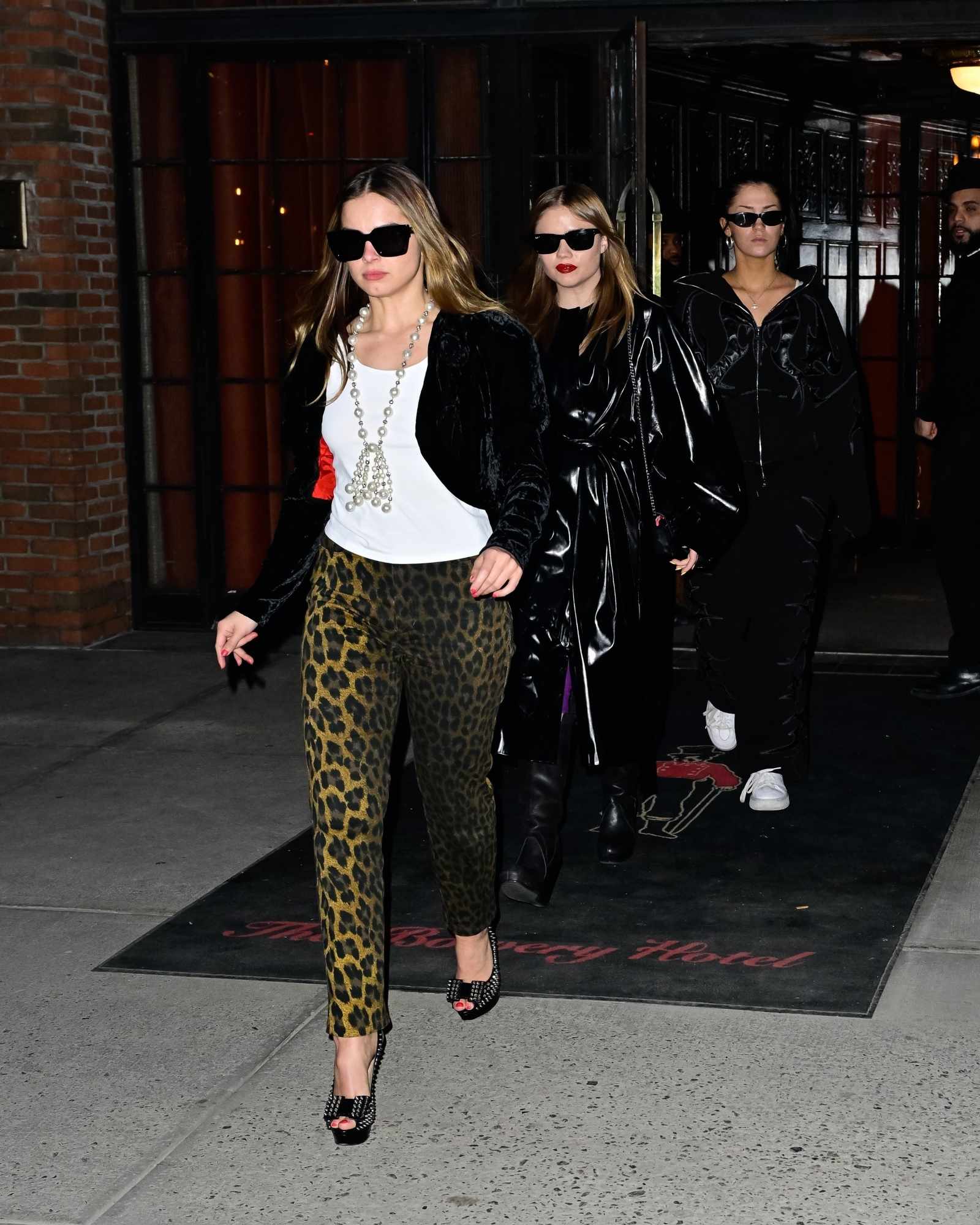 Addison Rae wears a black velvet jacket & leopard print pants
