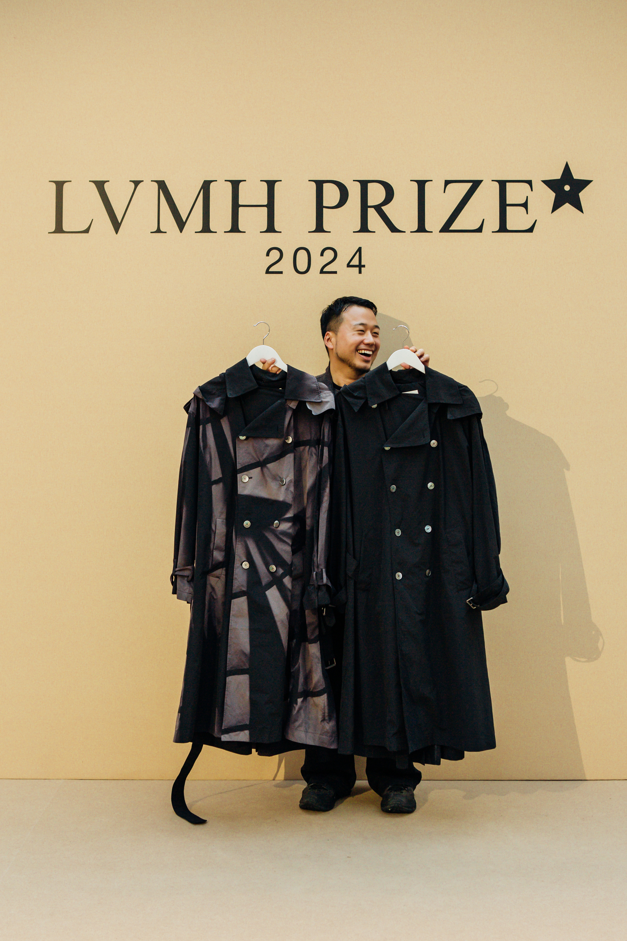 Designer JiyongKim seen holding his clothes at the 2024 LVMH Prize