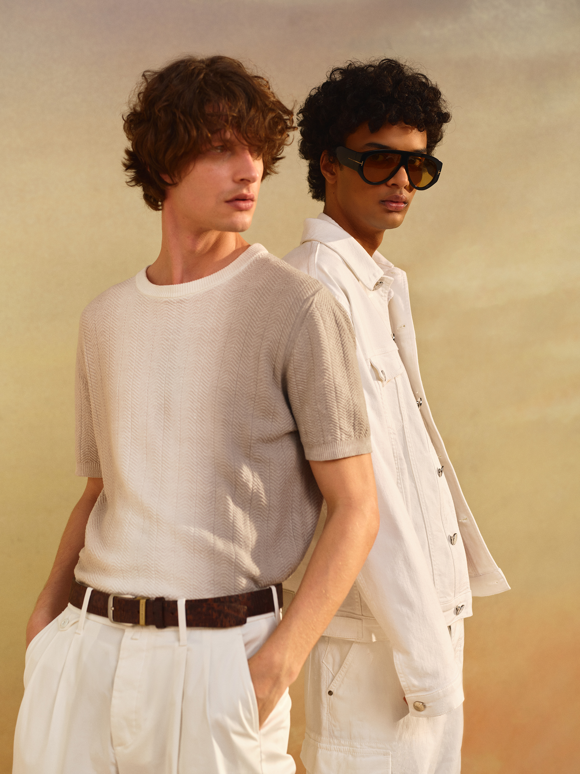 Two models pose together in all-white Jacob Cohën looks