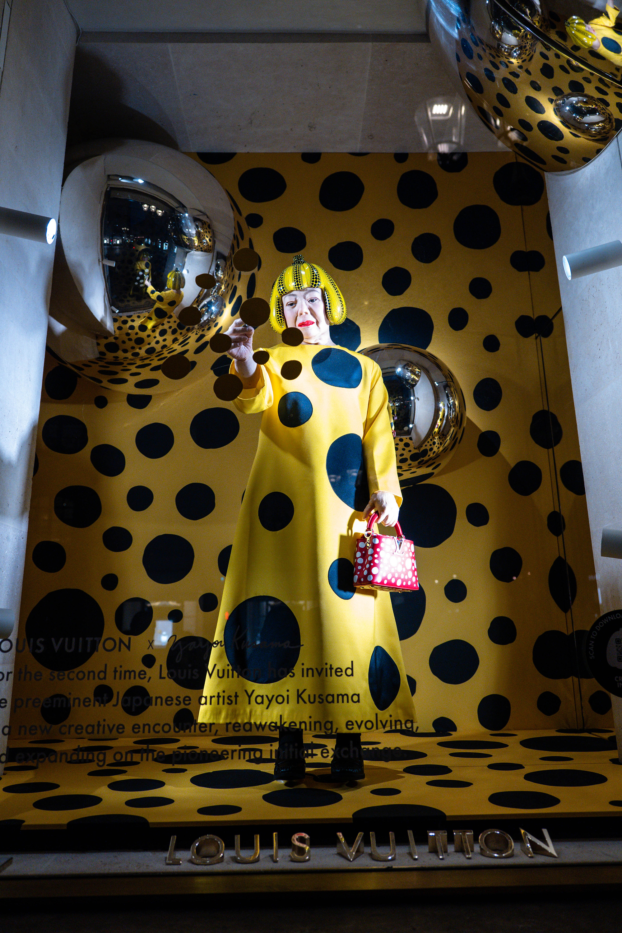 The facade of the Louis Vuitton Store displays a Yayoi Kusama robot and mirrors at Place Vendome on February 04, 2023 in Paris, France.
