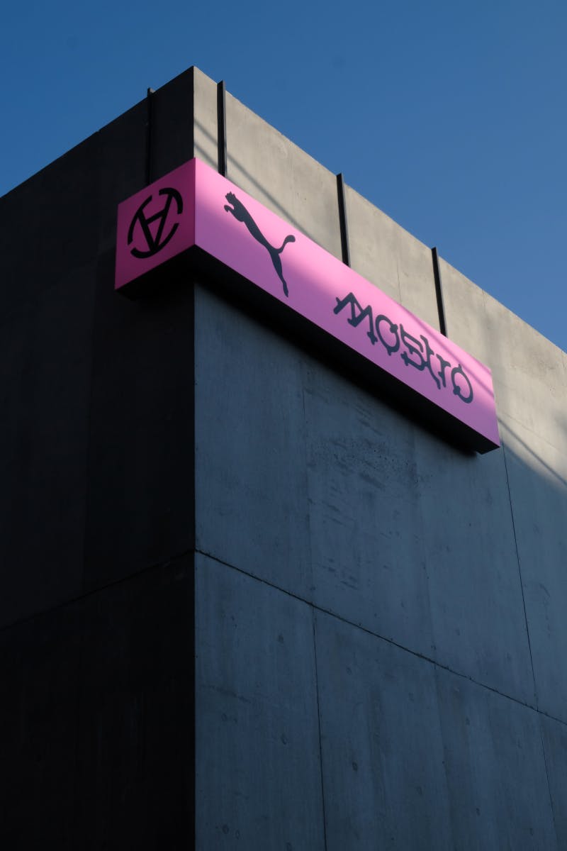 Exterior of an industrial building with large PUMA Mostro sign