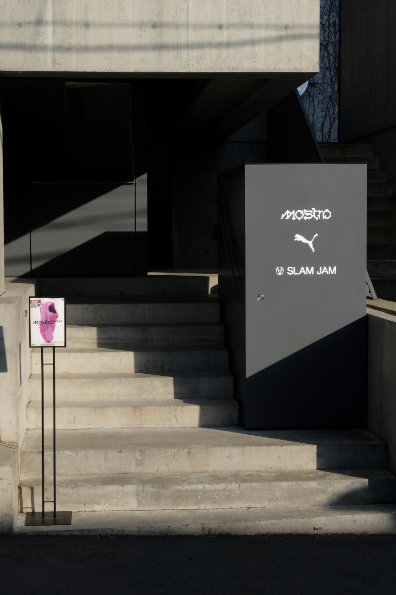Outside of a PUMA event with a sign and staircase