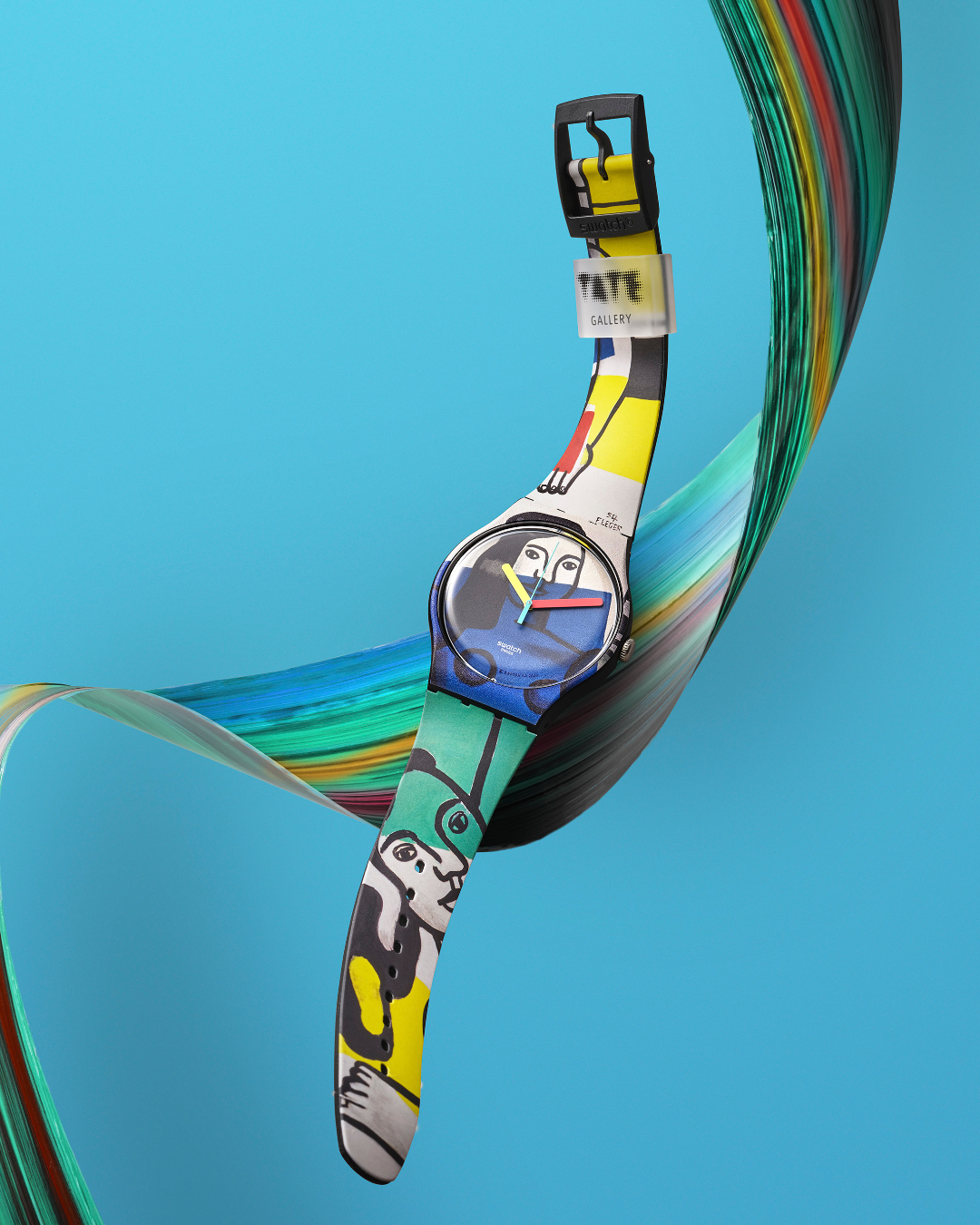 An artistically decorated watch in a green and blue colourway against a matching background